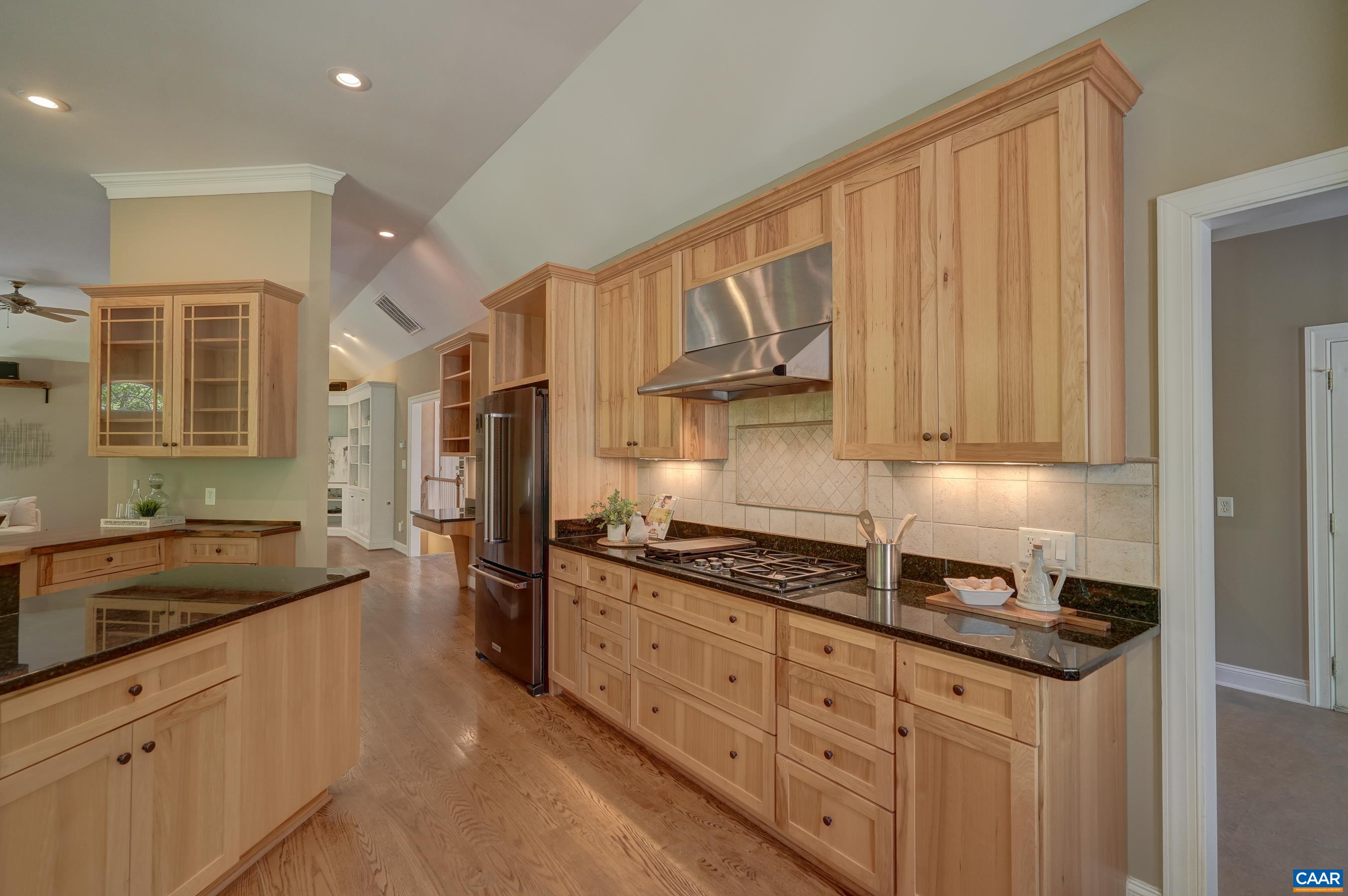 Dacor gas range, double wall oven, dishwasher and under cabinet microwave, plus a new Kitchenaid refrigerator.
