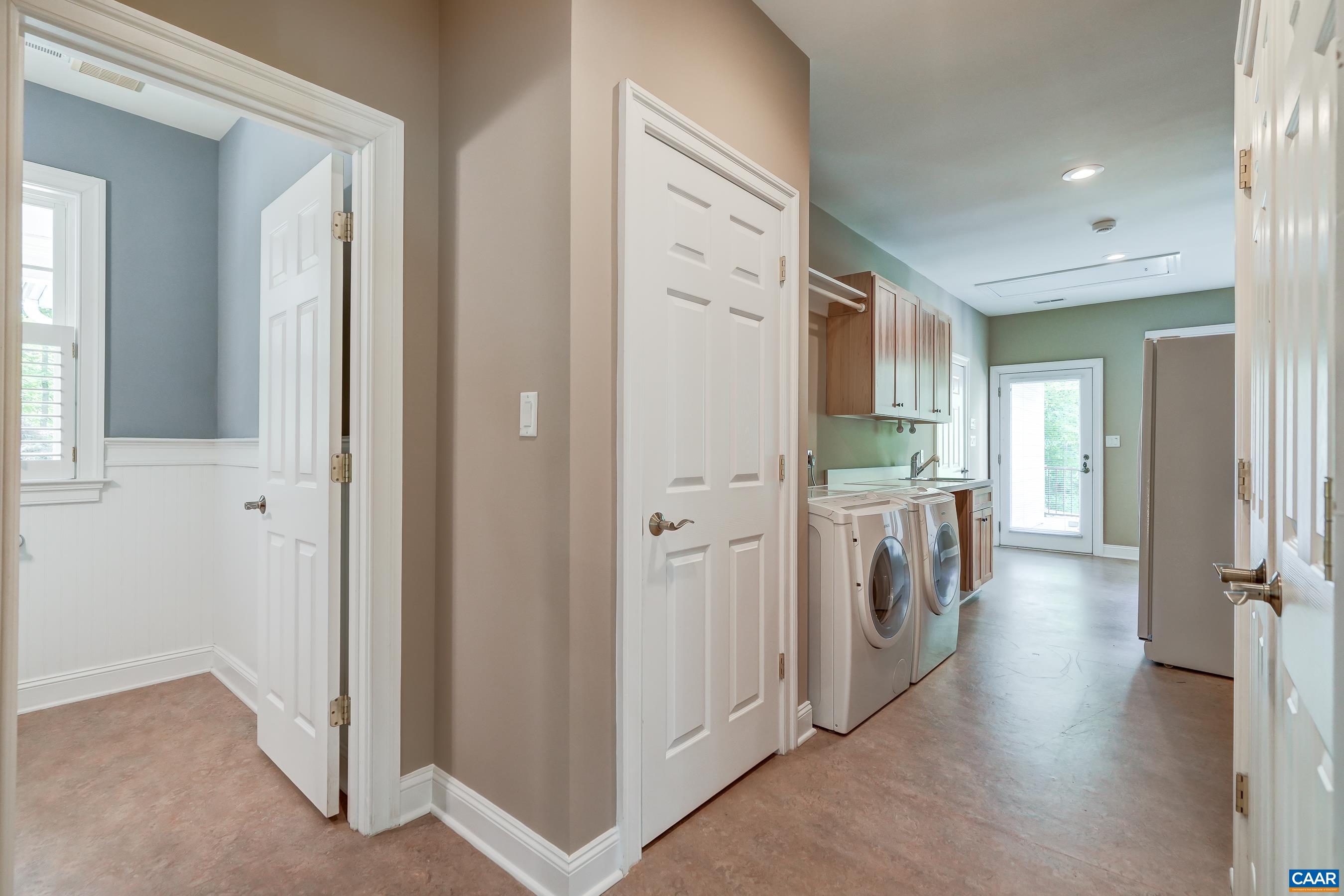 Butlers pantry/mudroom with extra fridge, extra storage and Bosch washer/dryer