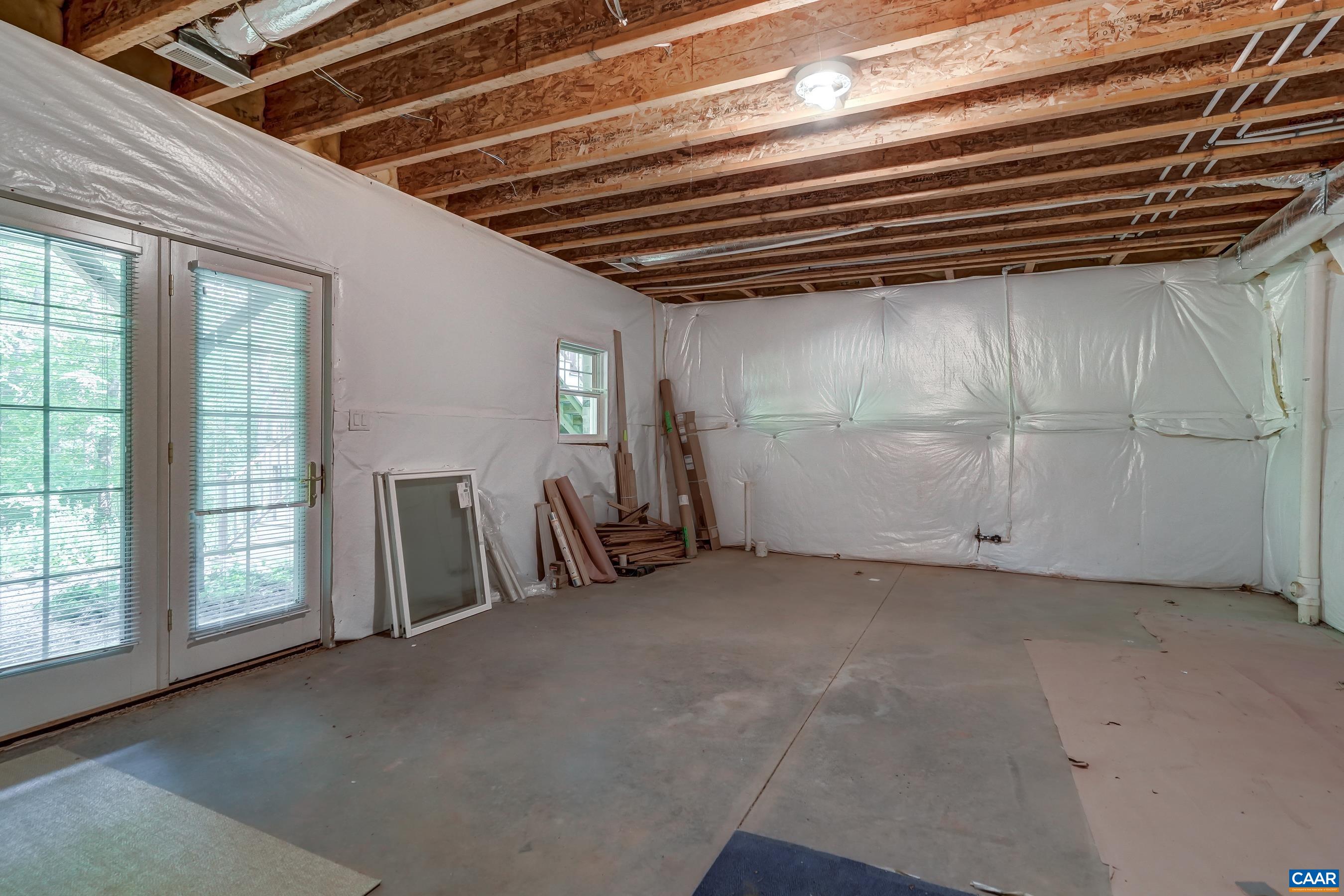Unfinished space with full bath rough in could be converted to a fourth bedroom with full ensuite bath.