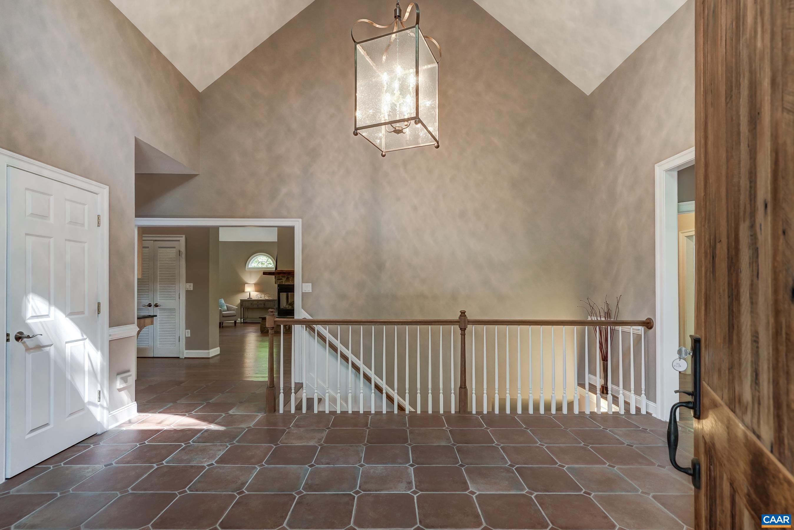 Vaulted entry way welcomes you in.