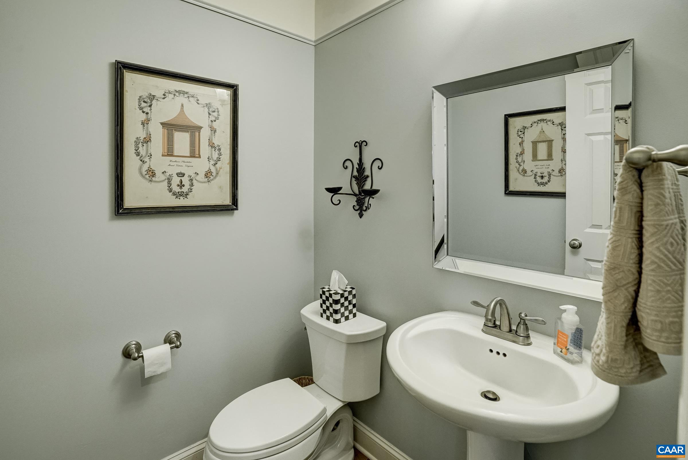 Powder room with pedestal sink. Powder room with pedestal sink.