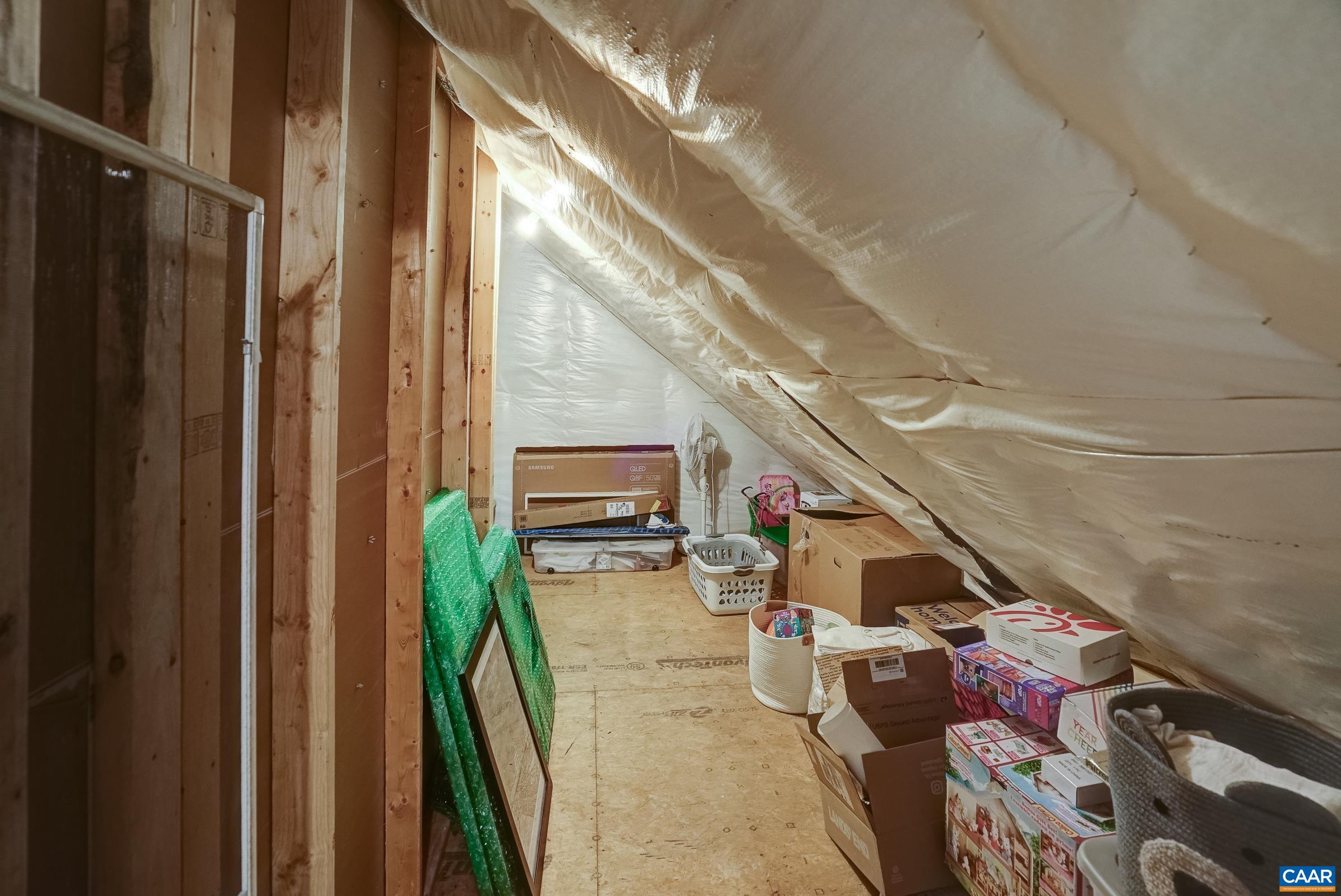 Walk in attic storage space. Walk in attic storage space.