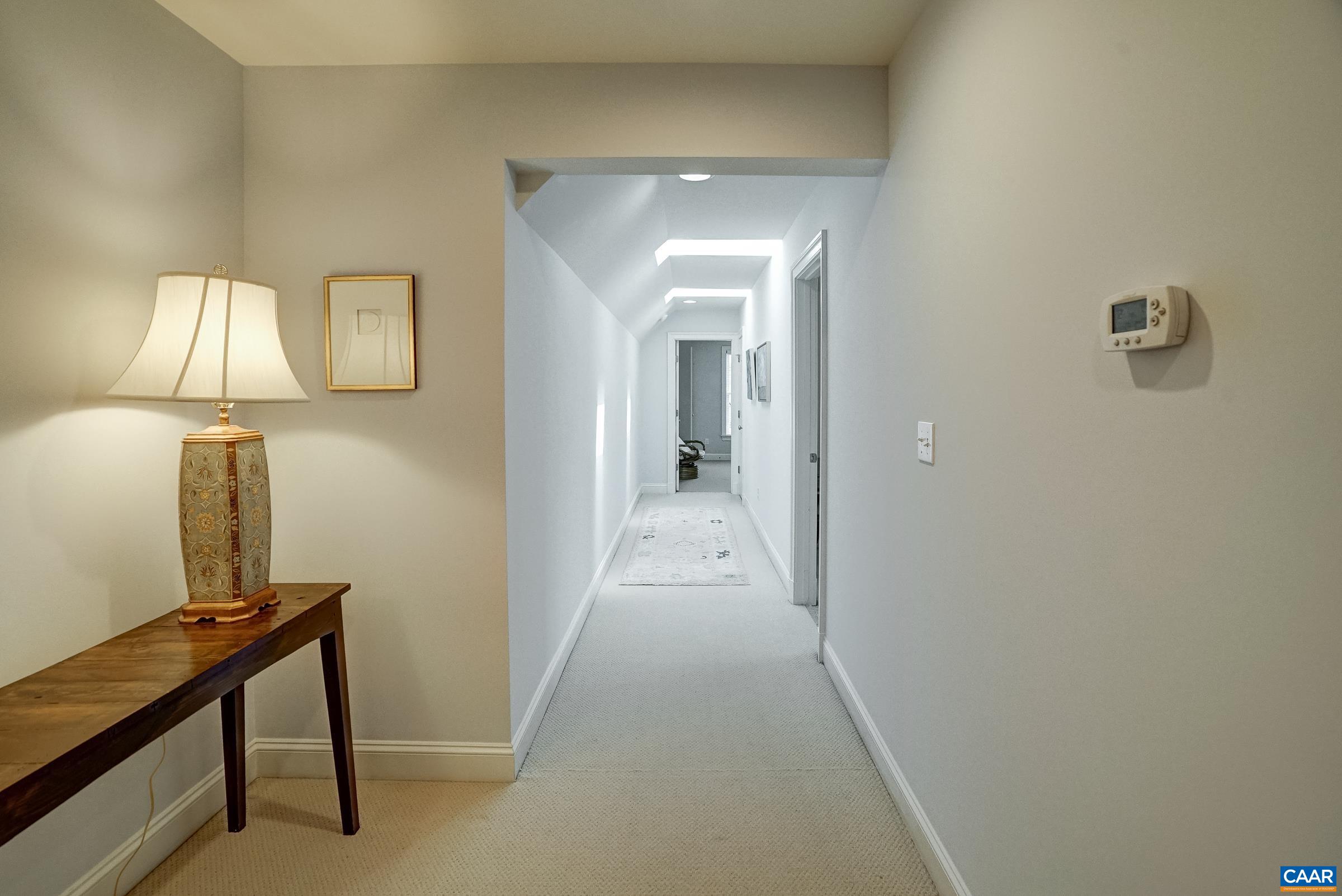 Hallway features beautiful skylights Hallway features beautiful skylights