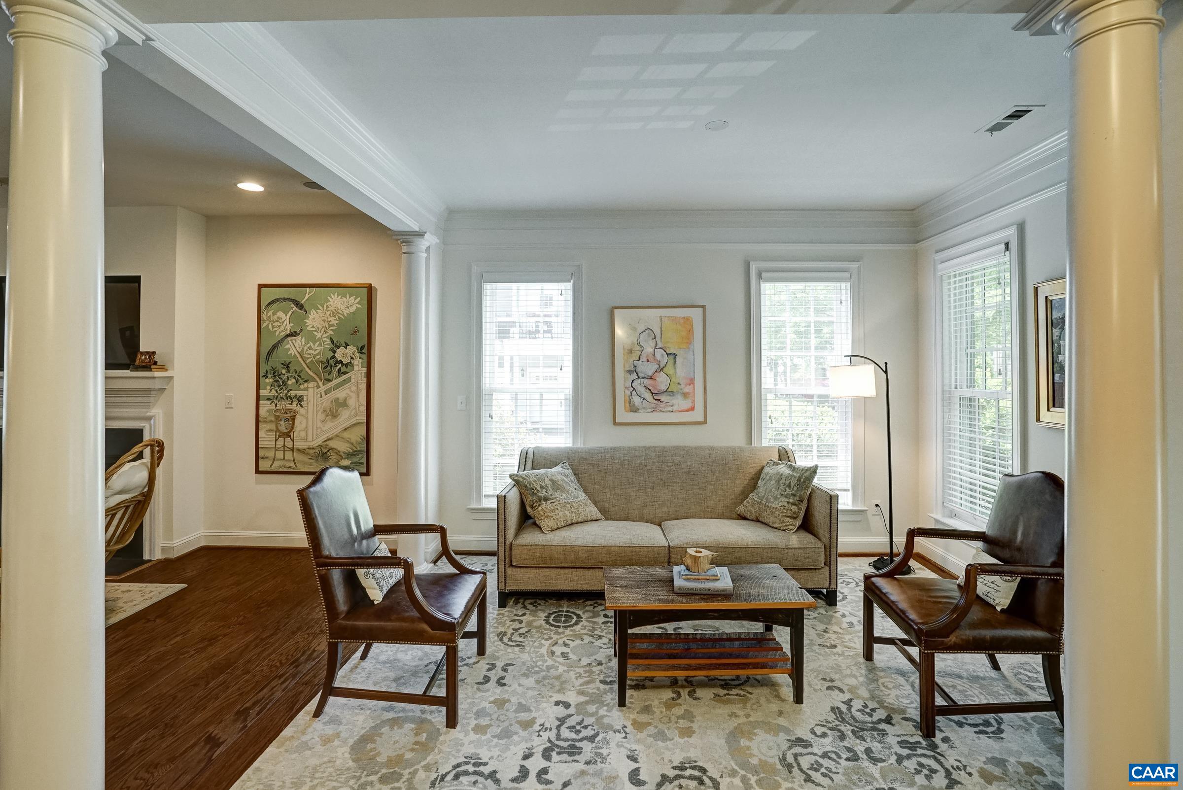 Formal living room with columns at the front of the home, could be a playroom or home office too! Formal living room with columns at the front of the home, could be a playroom or home office too!