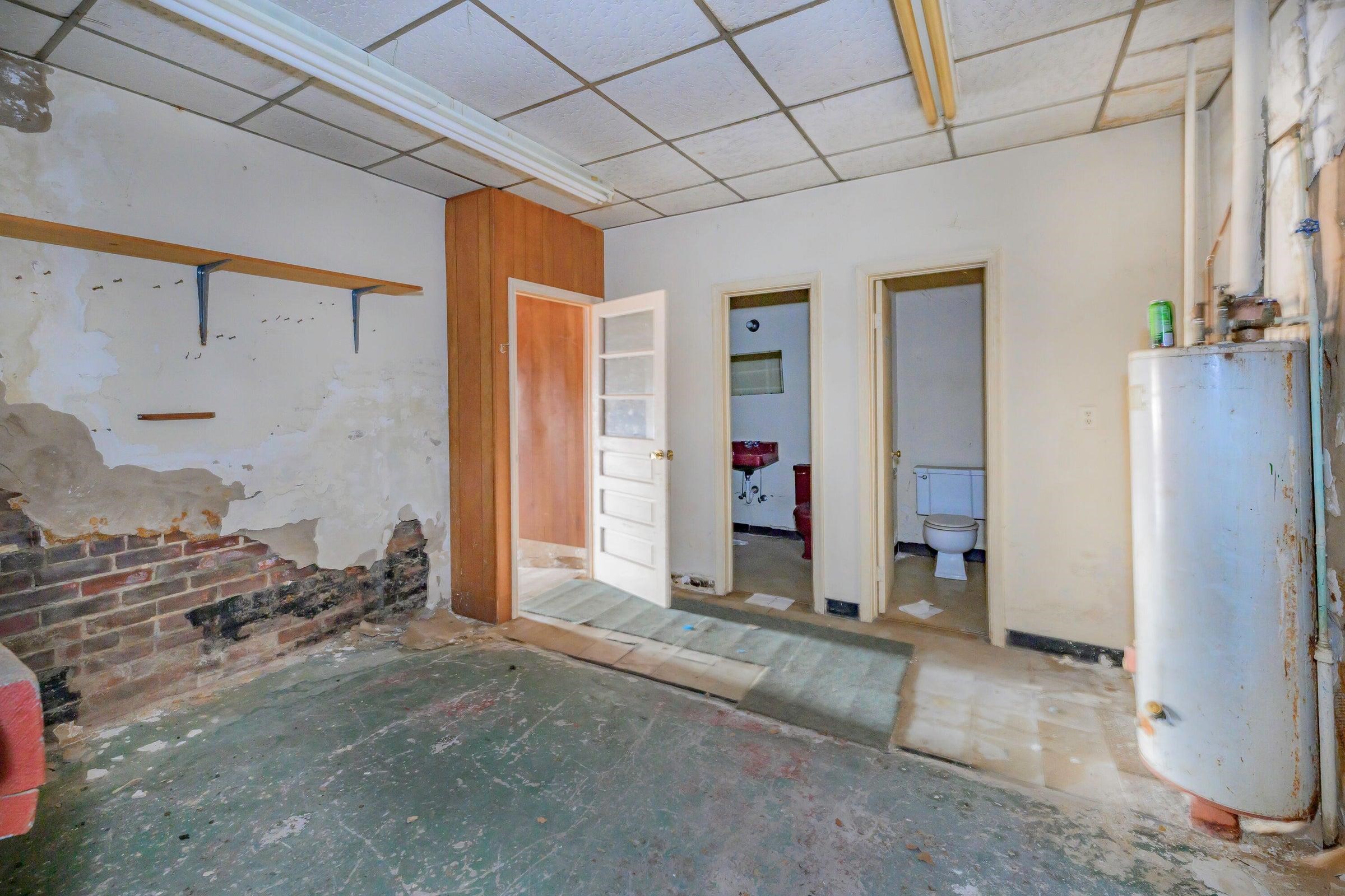 His and Her's bathrooms. Utility space. Back entrance.