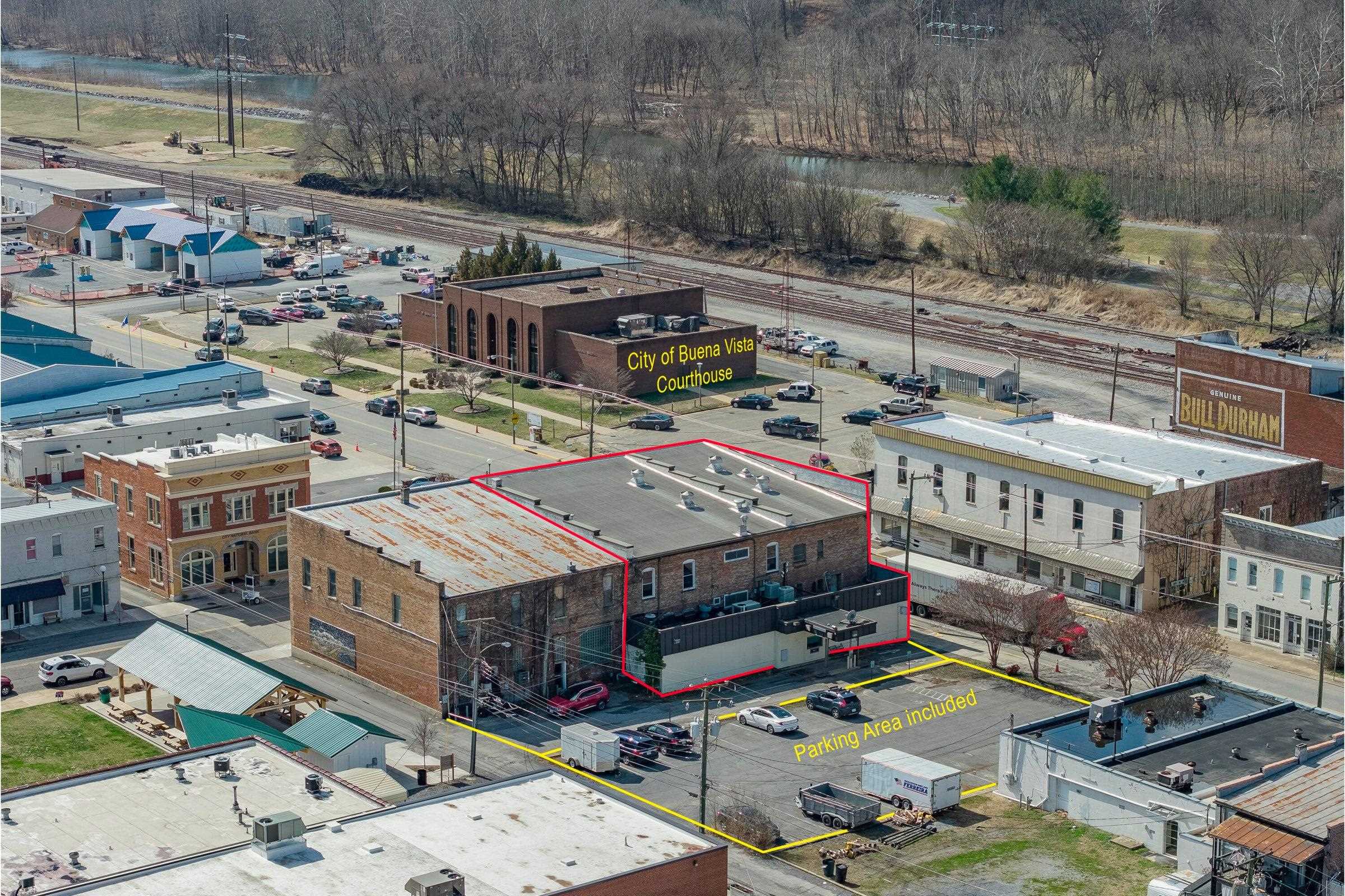 Bird's eye view shows the BV Court House across the street. Behind this building is a city park with a covered picnic pavilion.