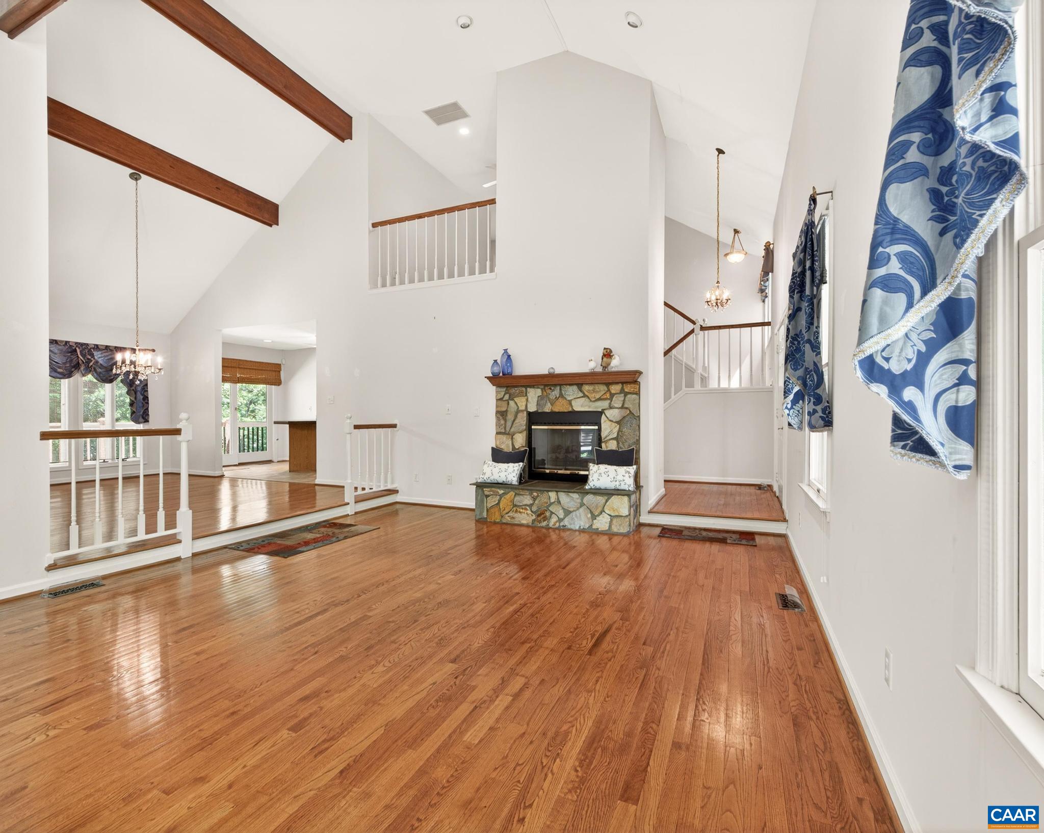 Ceiling & Hardwood Floors. Open to the Dining Room and Kitchen