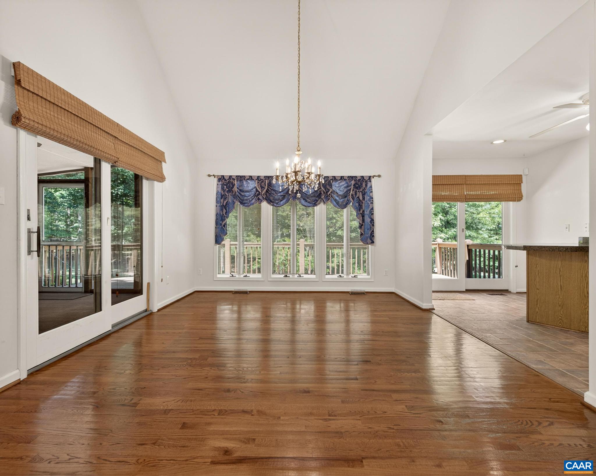 to the Kitchen & to the screened porch.