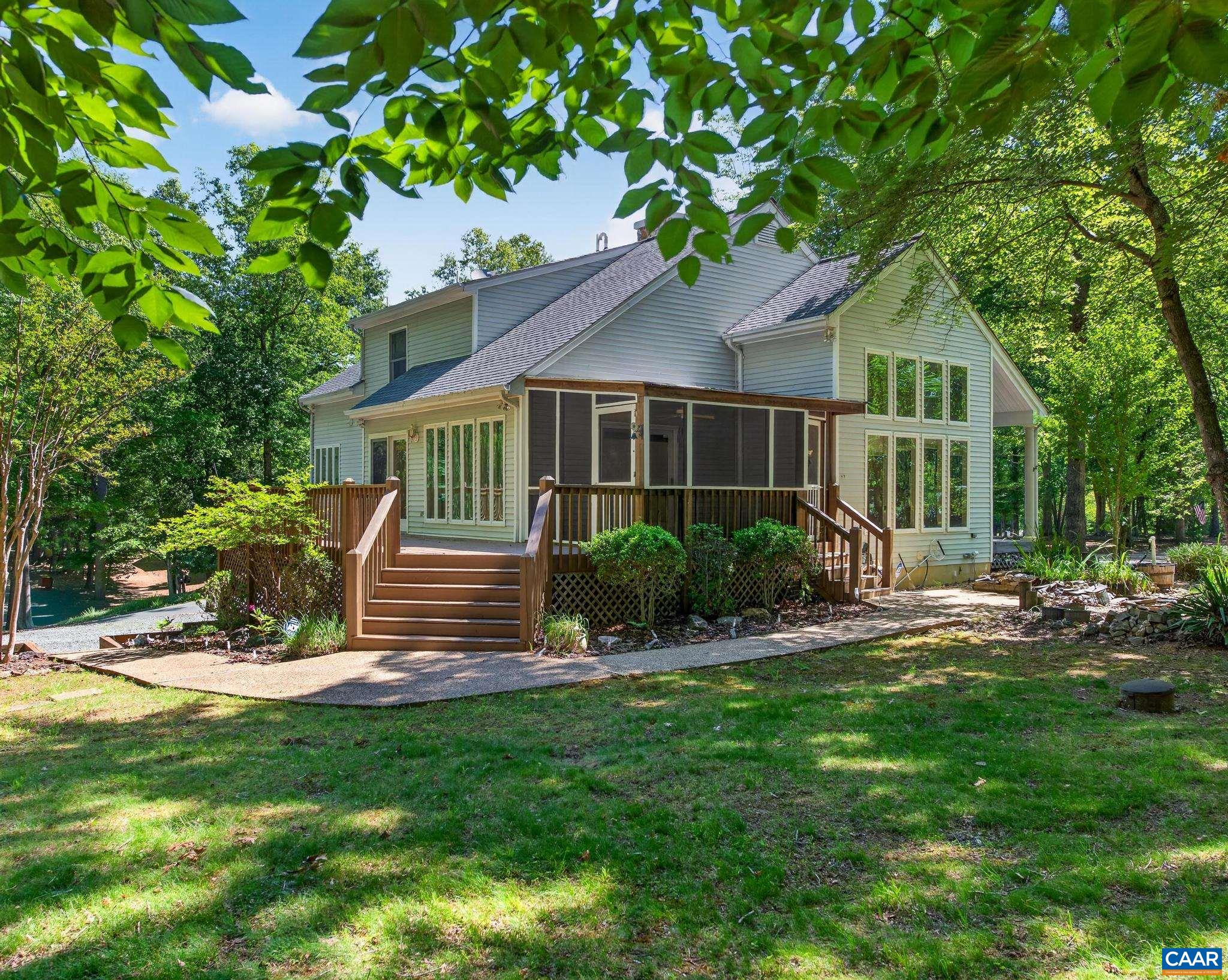 expansive rear deck & screened porch overlooking the Koi Ponds