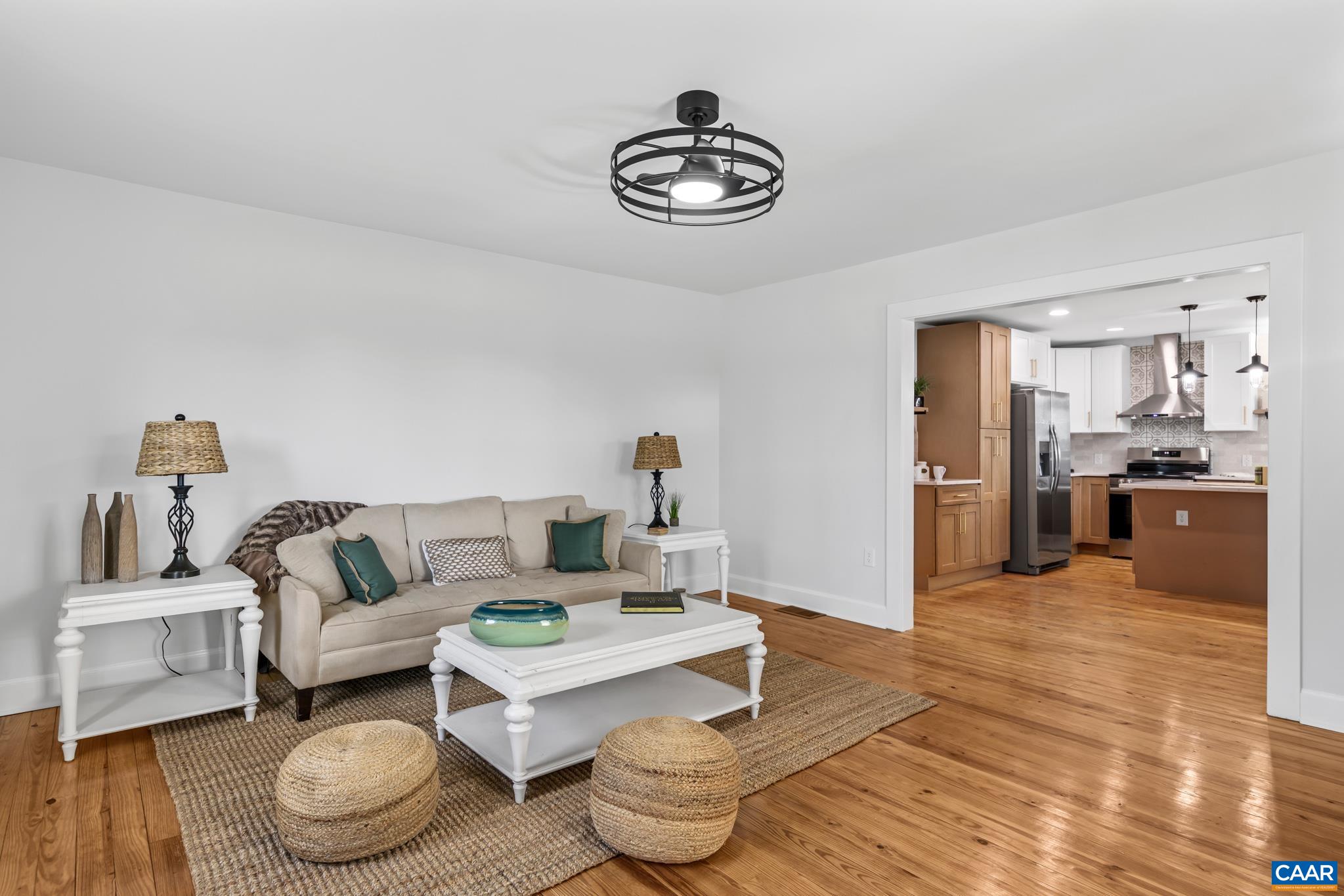 This living room offers a truly elevated setting for relaxing and entertaining, especially with the open floor plan design. This living room offers a truly elevated setting for relaxing and entertaining, especially with the open floor plan design.