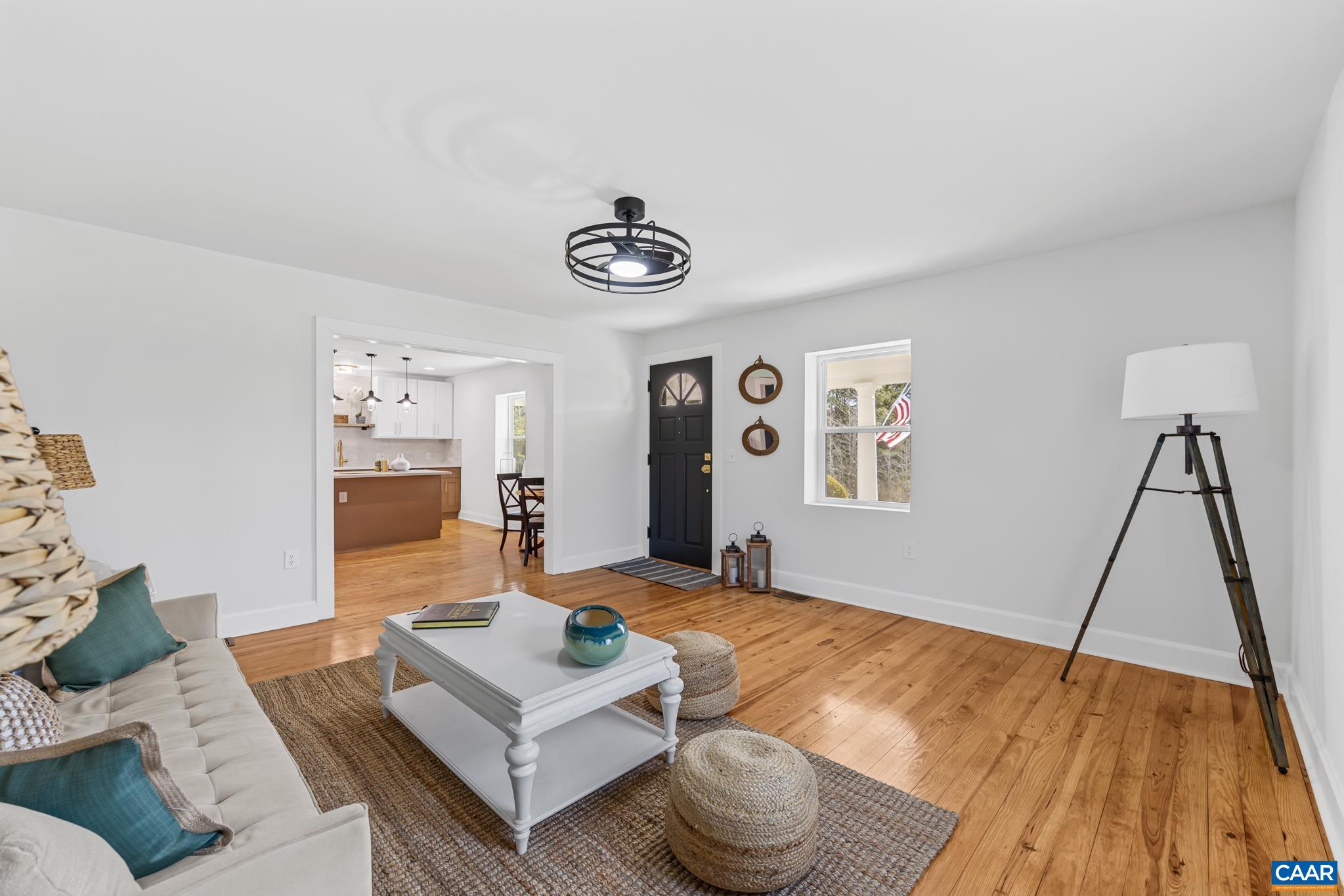 This living room showcases stunning hardwood floors that add warmth and timeless elegance. Beautifully complemented by an abundance of natural sunlight pouring through the windows. This light filled space feels both expansive and refined. This living room showcases stunning hardwood floors that add warmth and timeless elegance. Beautifully complemented by an abundance of natural sunlight pouring through the windows. This light filled space feels both expansive and refined.