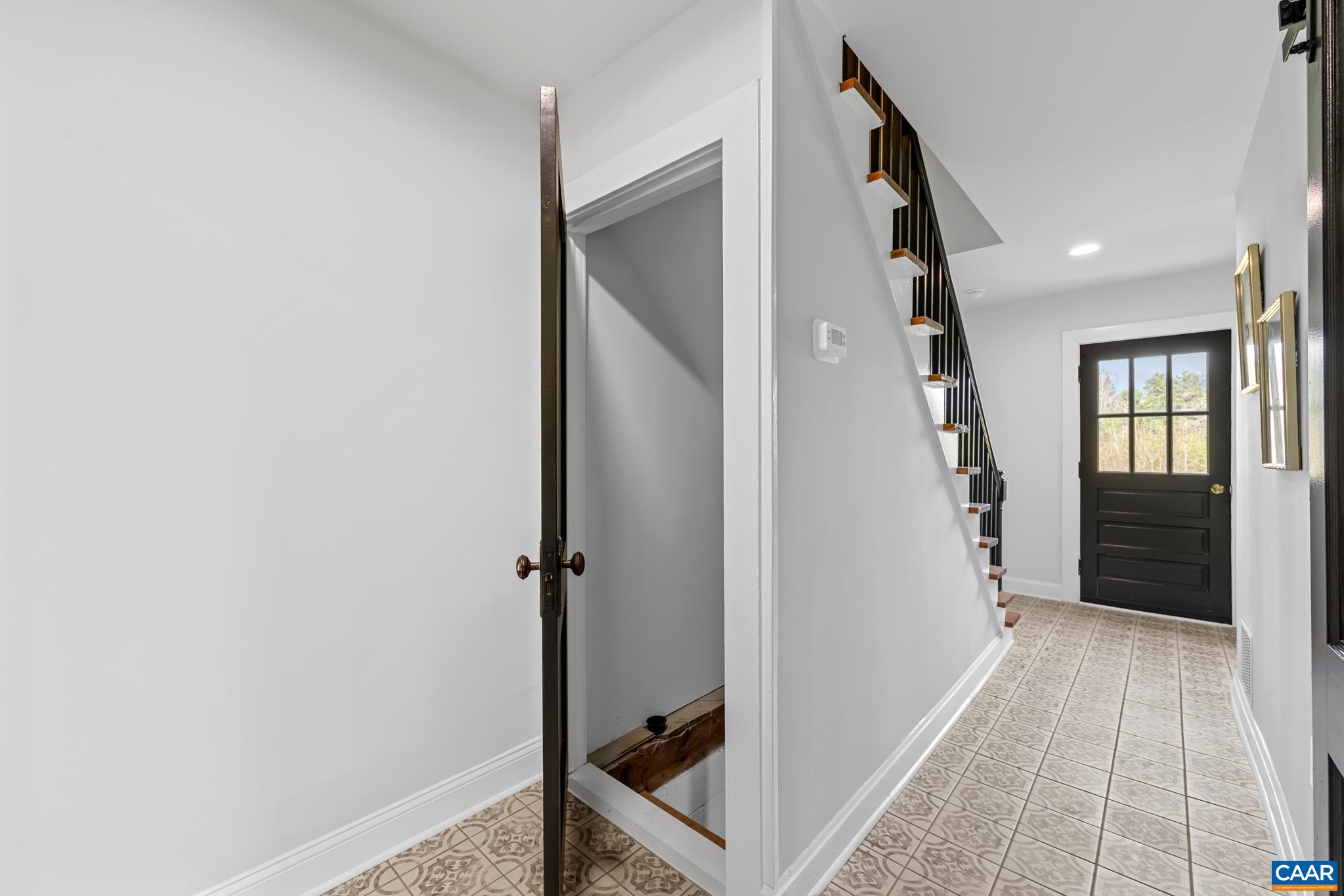 The tiled rear entry hallway offers a durable and stylish transition space from the back door into the home, providing both practicality and easy maintenance for everyday use The tiled rear entry hallway offers a durable and stylish transition space from the back door into the home, providing both practicality and easy maintenance for everyday use