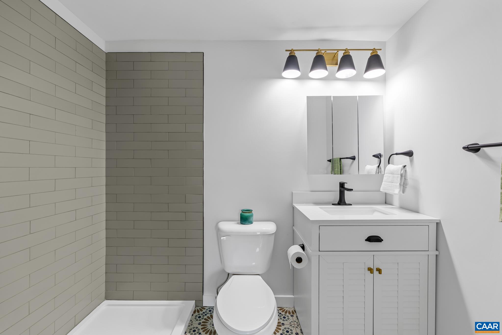 The primary bathroom has been tastefully remodeled and features a spacious stand up shower highlighting custom tile work. Offering a fresh, modern and relaxing atmosphere. The primary bathroom has been tastefully remodeled and features a spacious stand up shower highlighting custom tile work. Offering a fresh, modern and relaxing atmosphere.