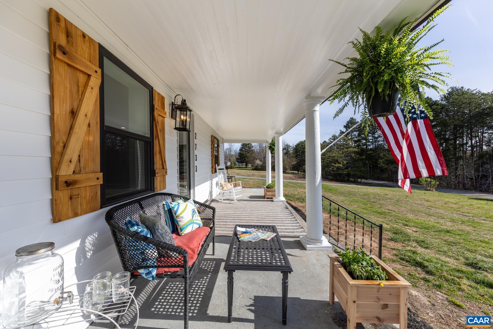 Stunning full length covered front porch invites you to slow down and enjoy the beauty of the surrounding countryside. Plenty of room for family and friends to rock the day away while sipping sweet tea. Stunning full length covered front porch invites you to slow down and enjoy the beauty of the surrounding countryside. Plenty of room for family and friends to rock the day away while sipping sweet tea.