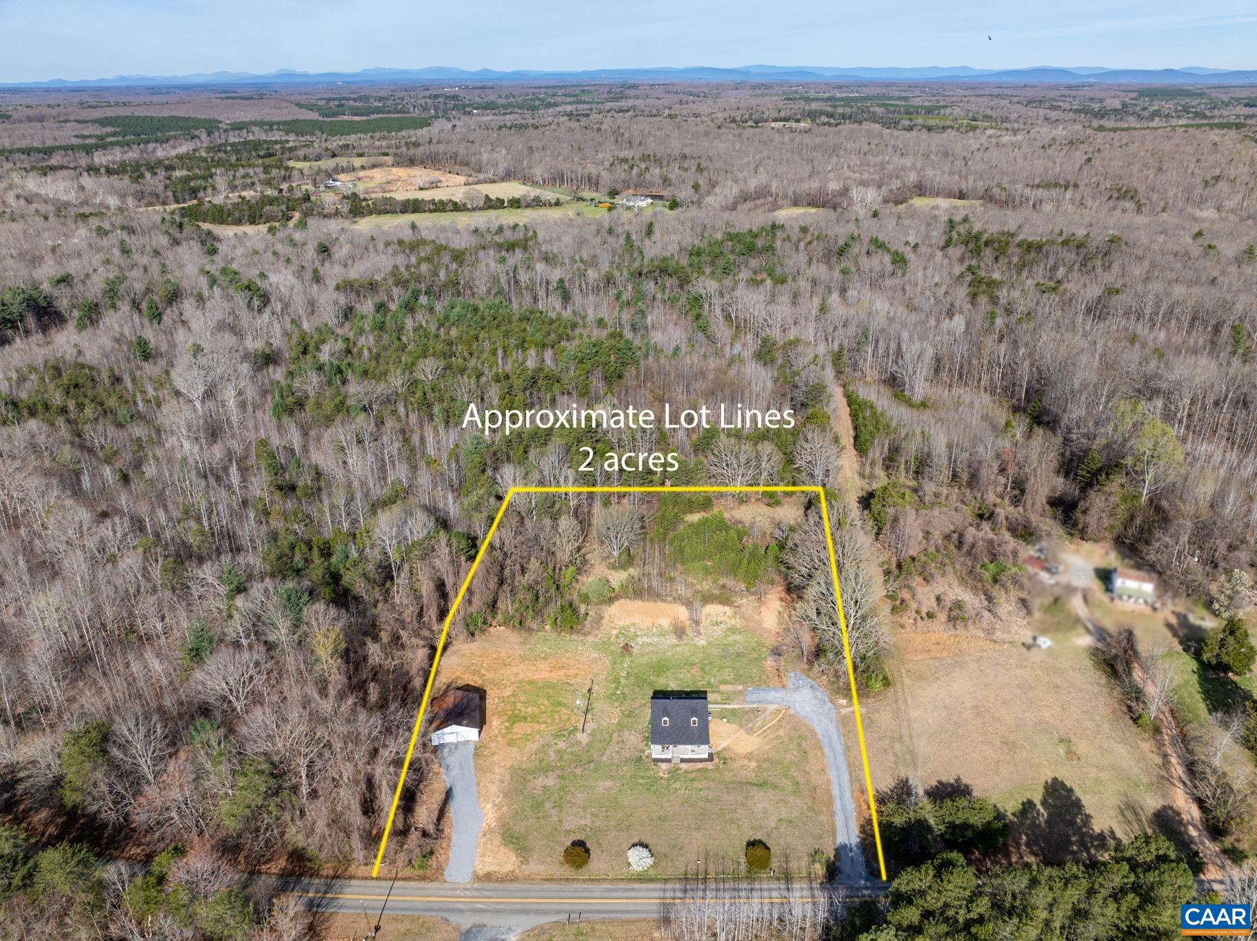 A striking aerial view showcases the property beautifully surrounded by mature forest offering a sense of privacy, natural beauty and peaceful seclusion A striking aerial view showcases the property beautifully surrounded by mature forest offering a sense of privacy, natural beauty and peaceful seclusion