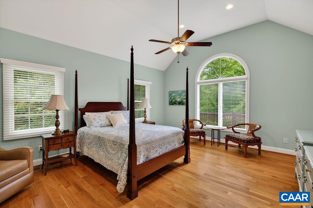 Spacious primary suite with cathedral ceilings and beautiful views overlooking the golf fairway. Spacious primary suite with cathedral ceilings and beautiful views overlooking the golf fairway.
