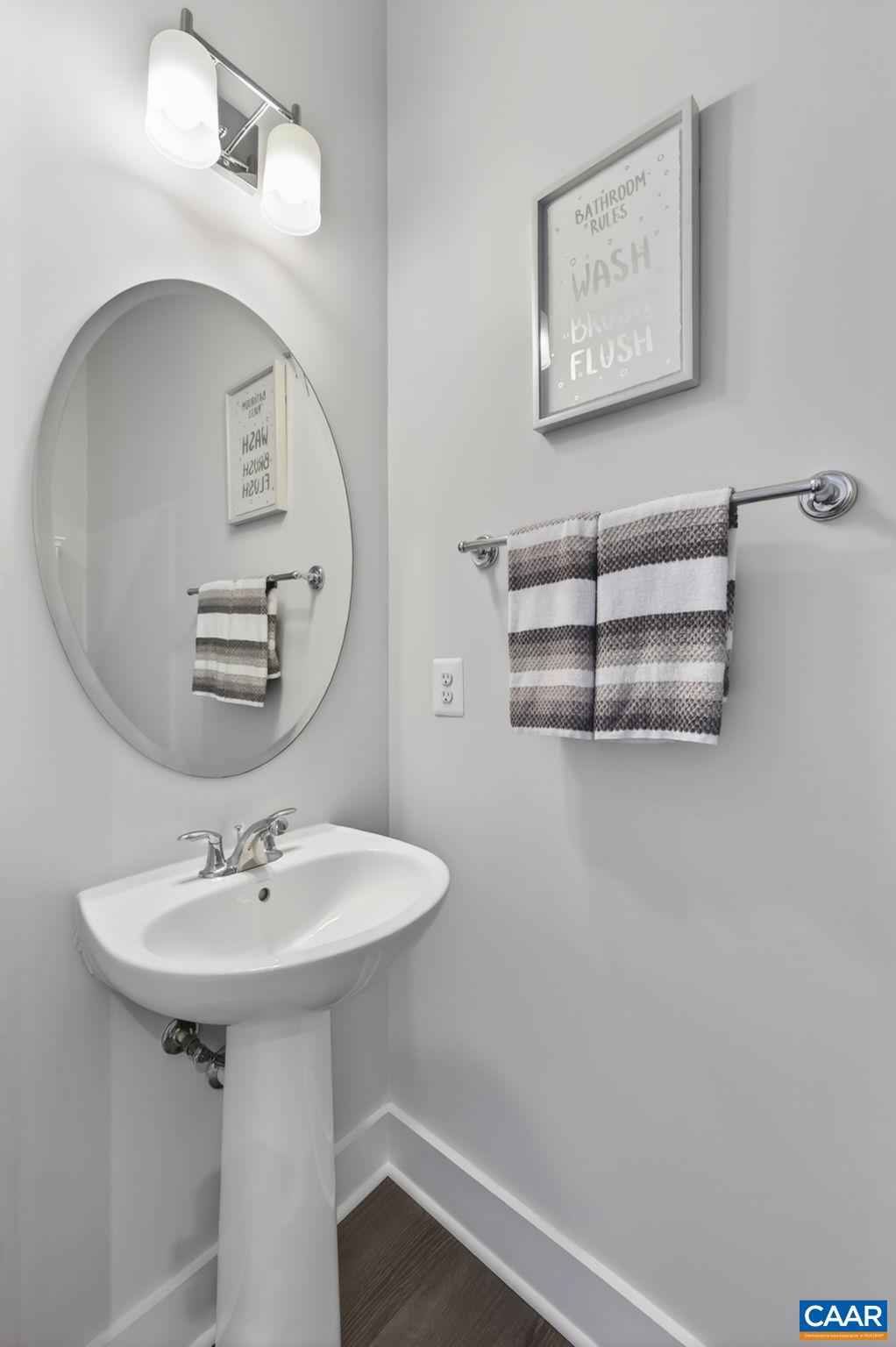 Half bath off foyer. Half bath off foyer.