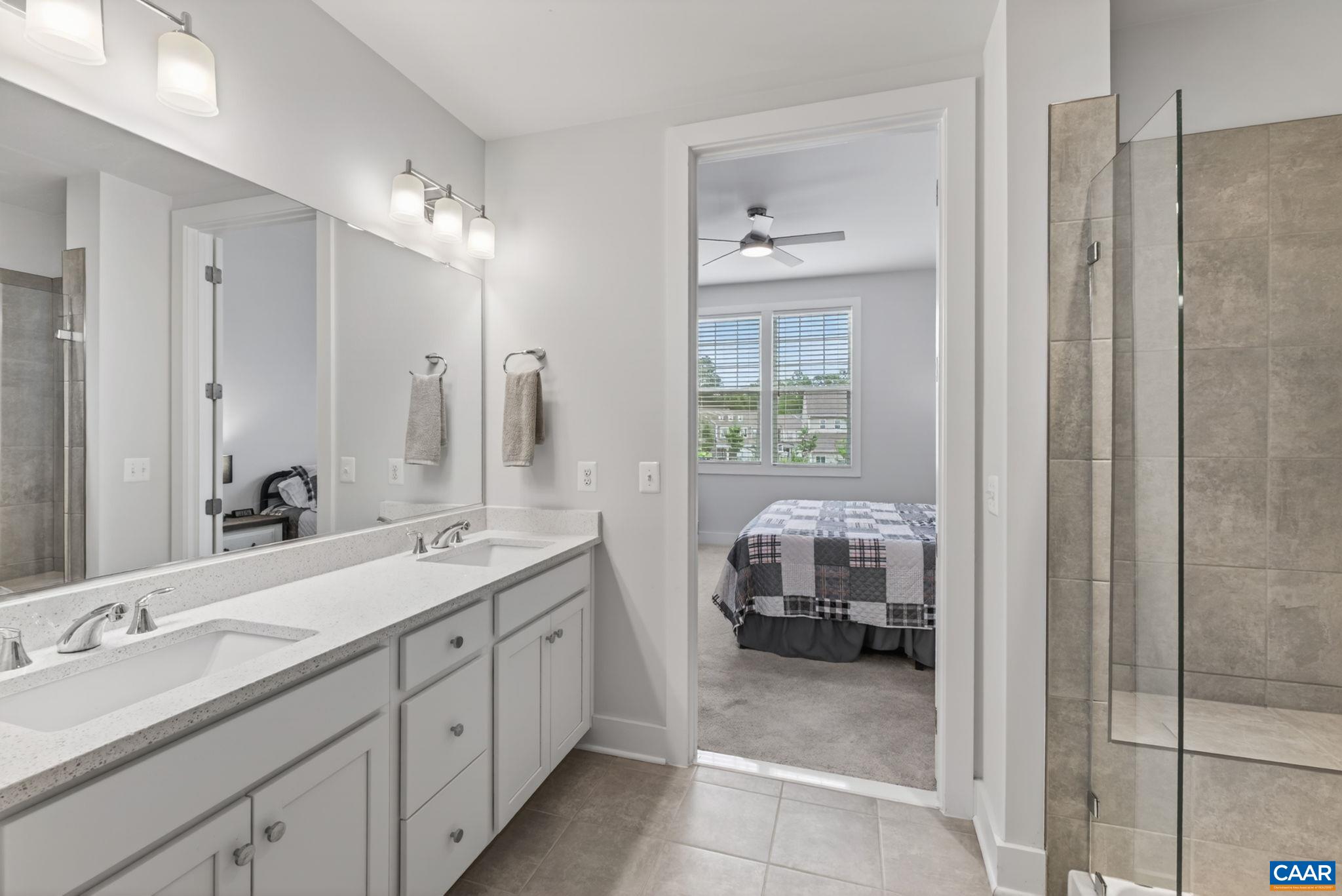 Tiled primary bathroom. Tiled primary bathroom.