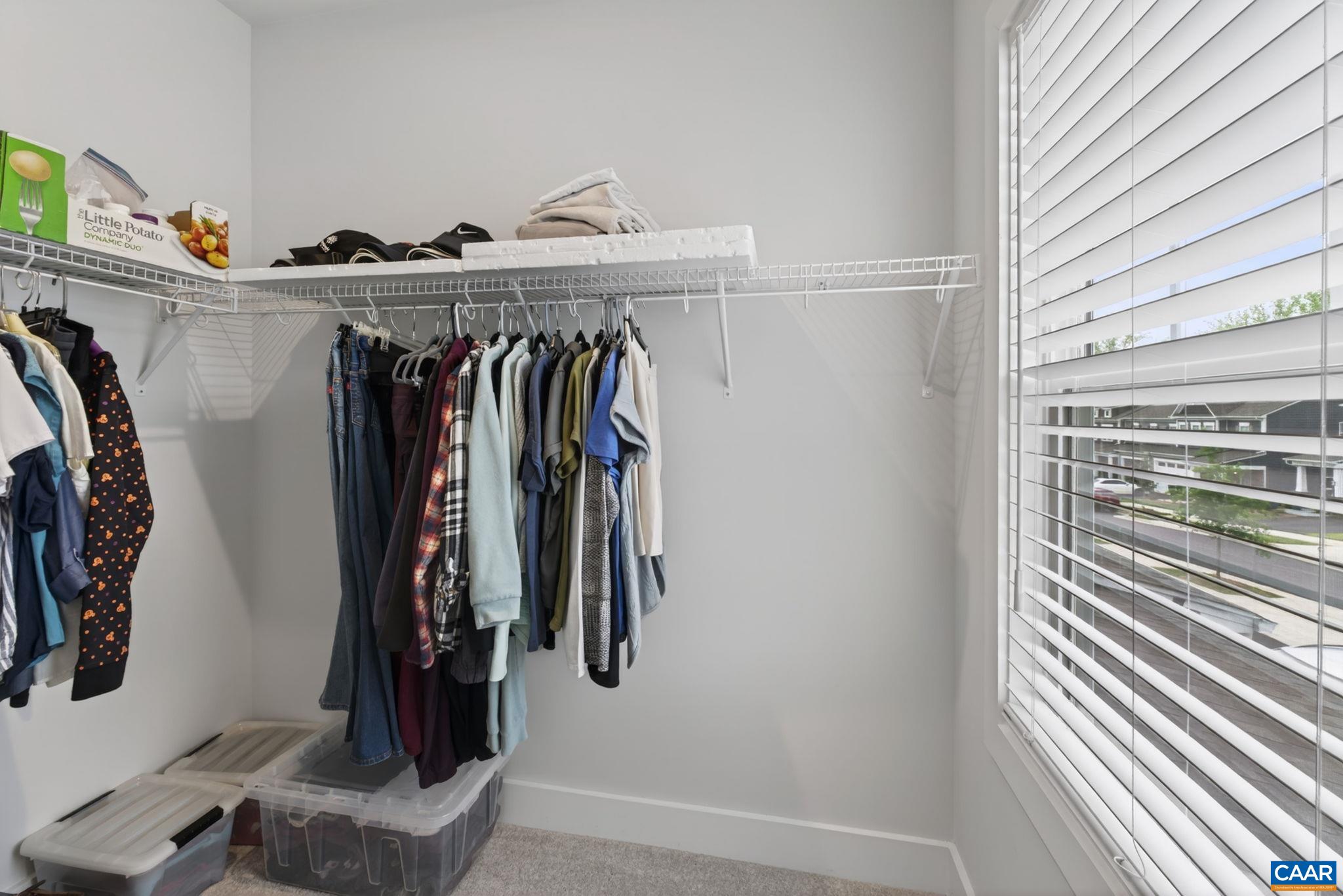Second level walk-in bedroom closet with window. Second level walk-in bedroom closet with window.