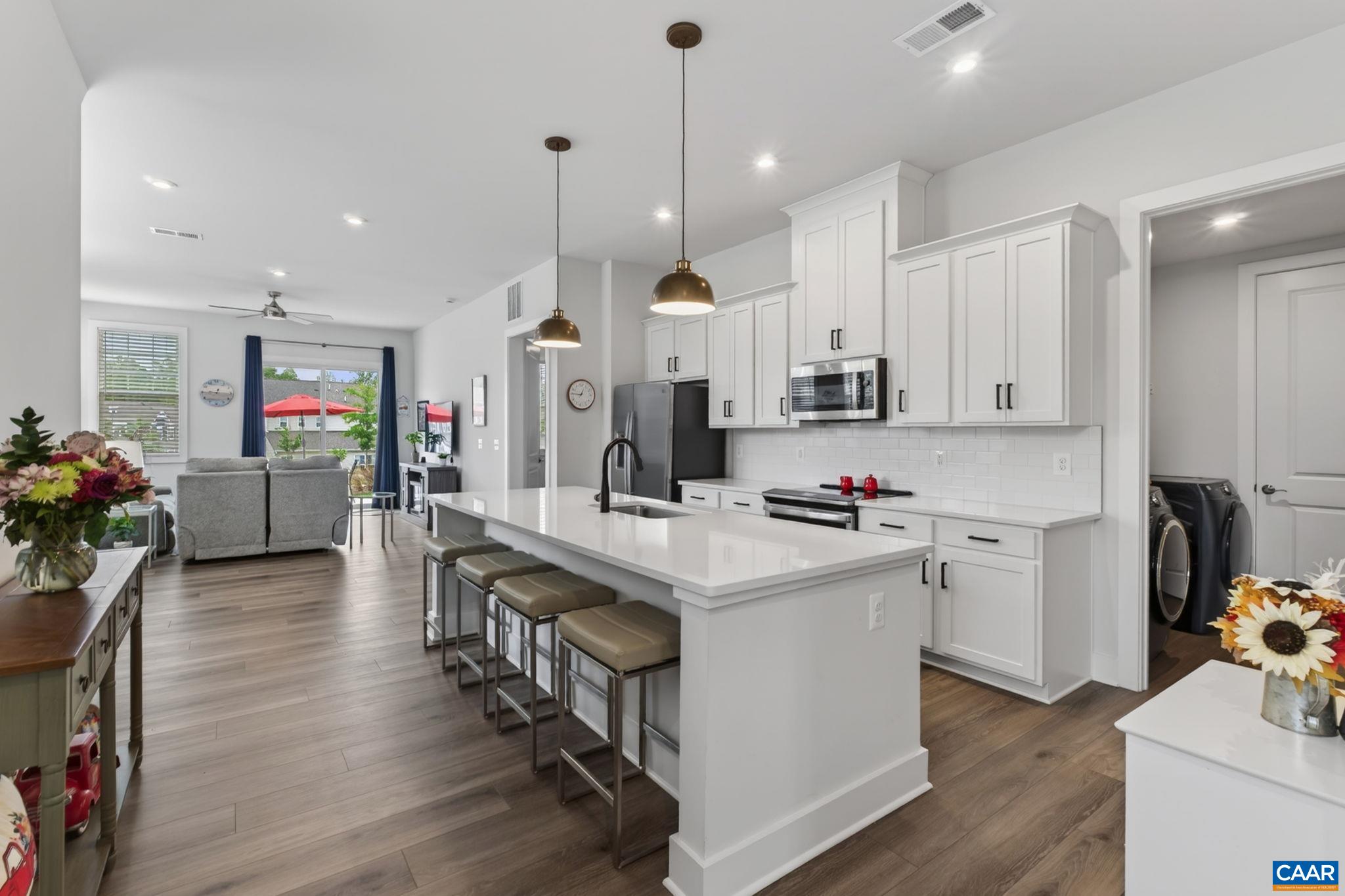 Gourmet kitchen with quartz counters, stainless appliances. Gourmet kitchen with quartz counters, stainless appliances.