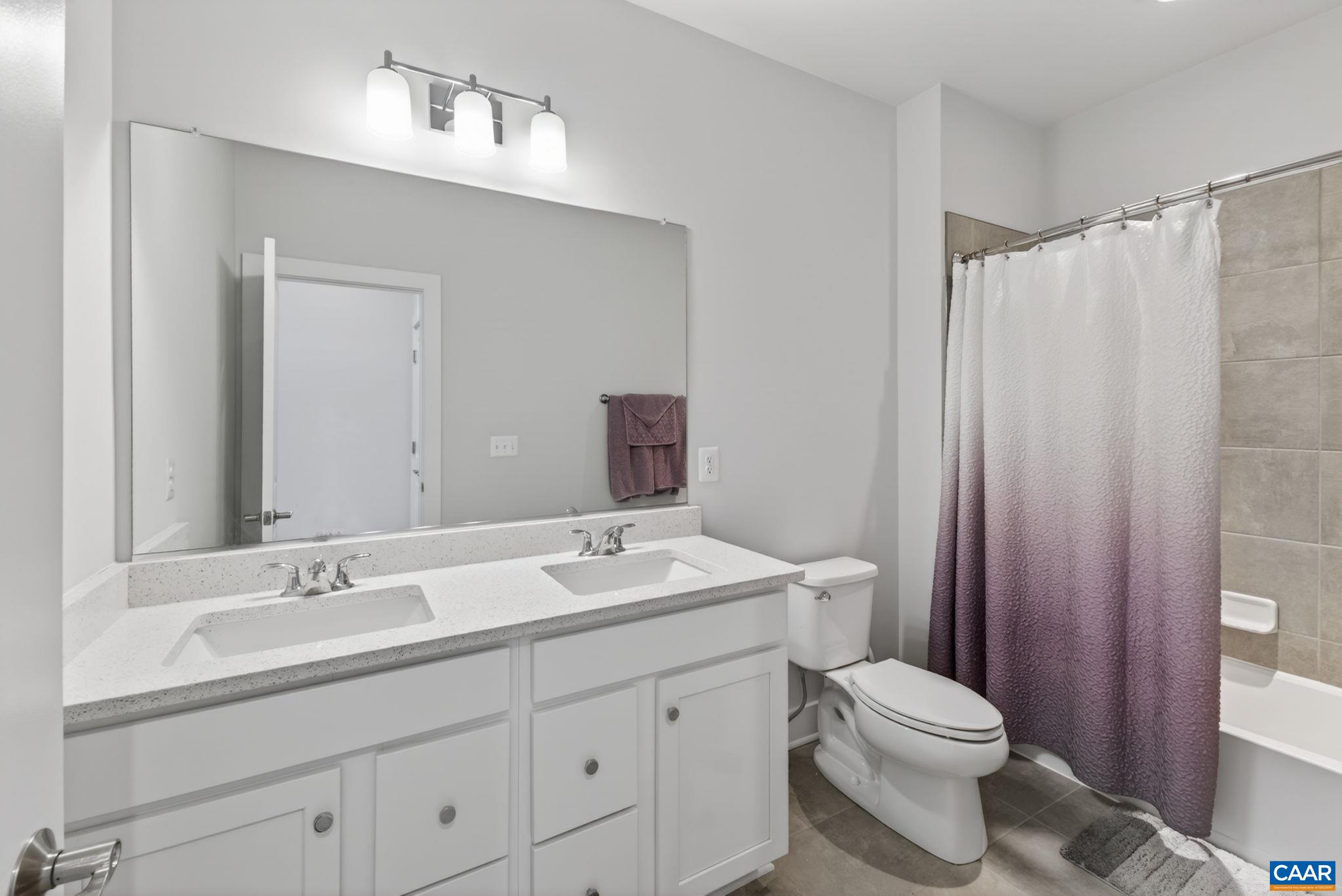 Tiled second level full bathroom. Tiled second level full bathroom.