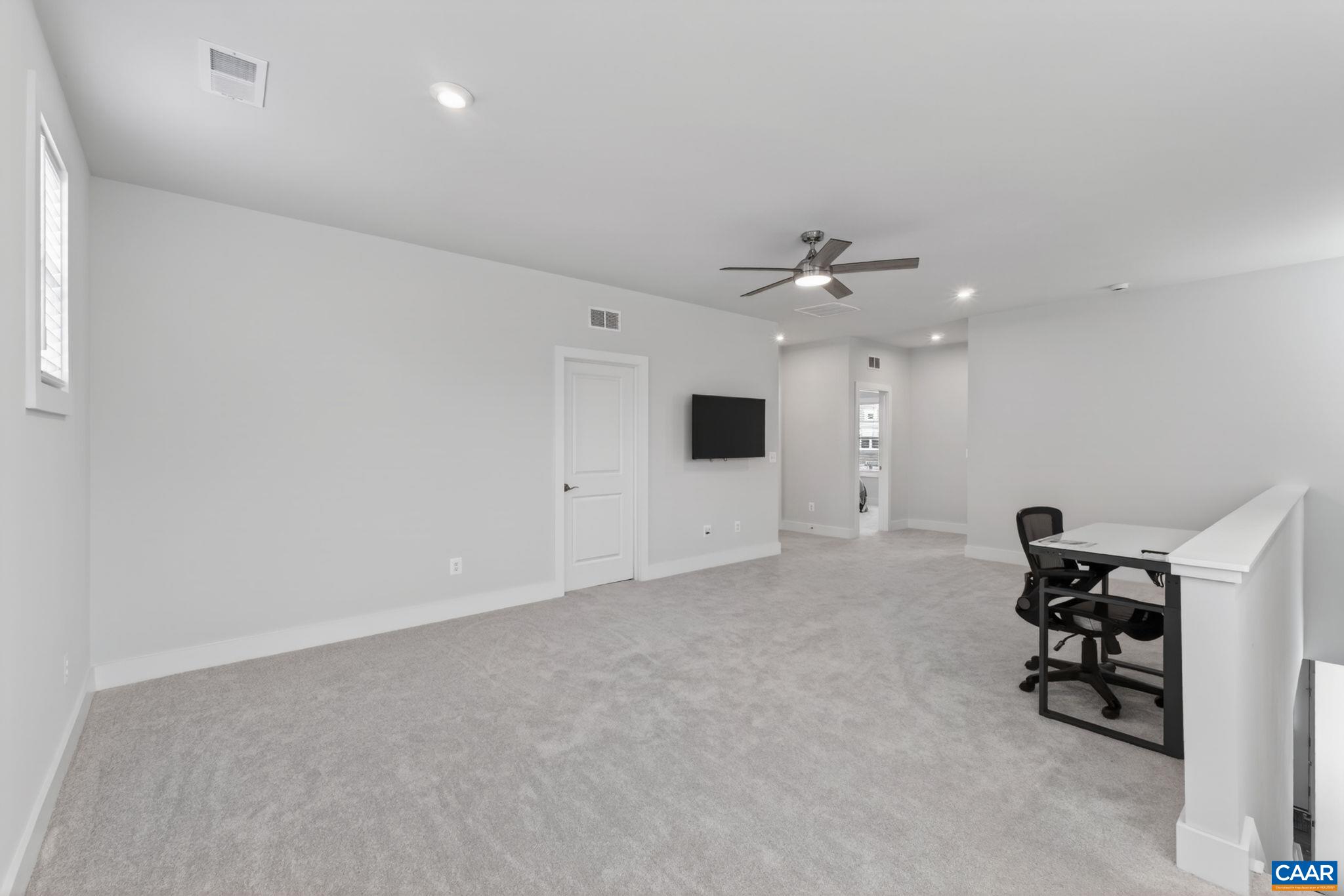 Large second level family room with utility/storage room that could offer additional finished space. Large second level family room with utility/storage room that could offer additional finished space.