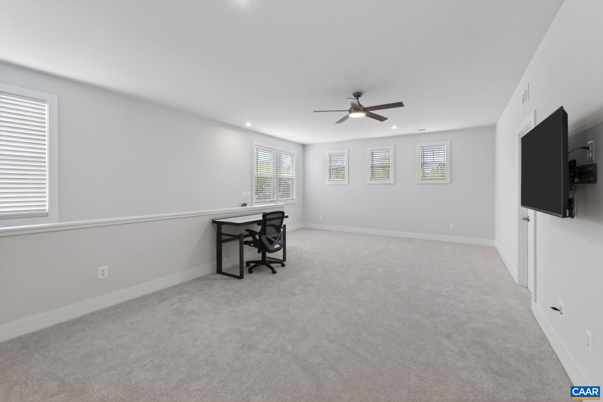 Large and bright upstairs family room perfect for work or play. Large and bright upstairs family room perfect for work or play.