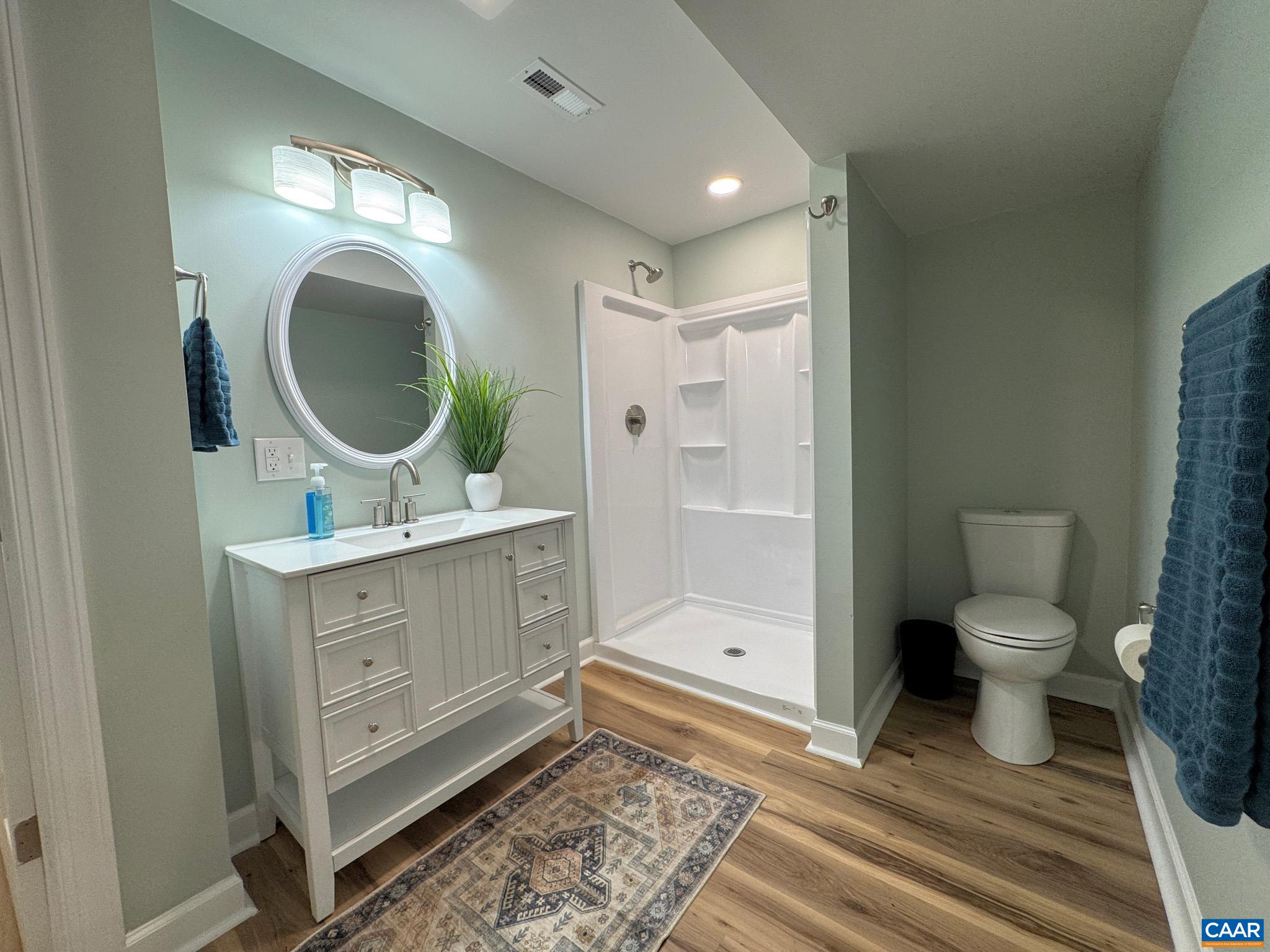 ...with Beautiful Vanity, Fixtures and Stand-up Shower ...with Beautiful Vanity, Fixtures and Stand-up Shower
