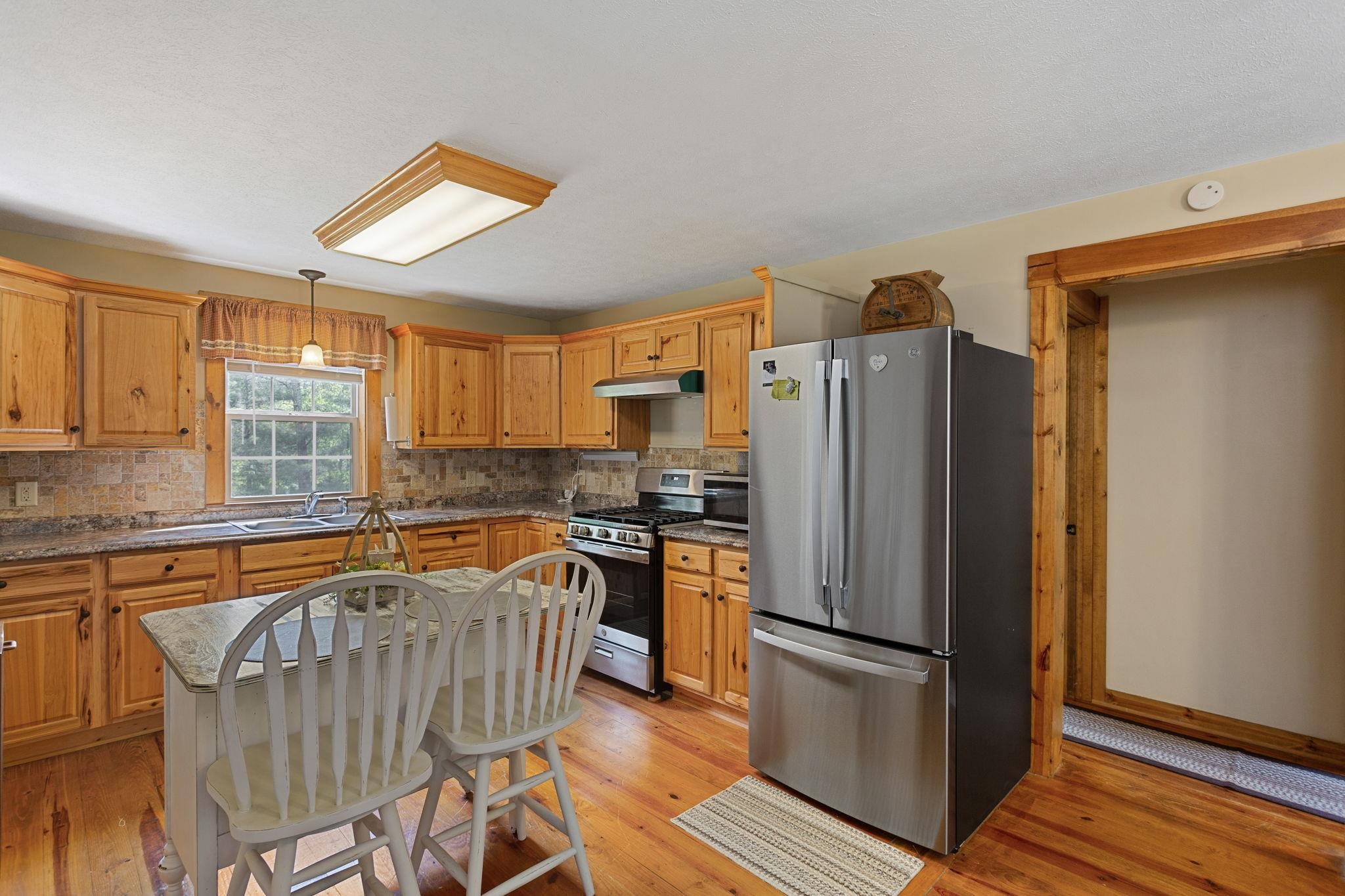 with family room and owners suite on the left and 2nd bedroom and laundry on the right