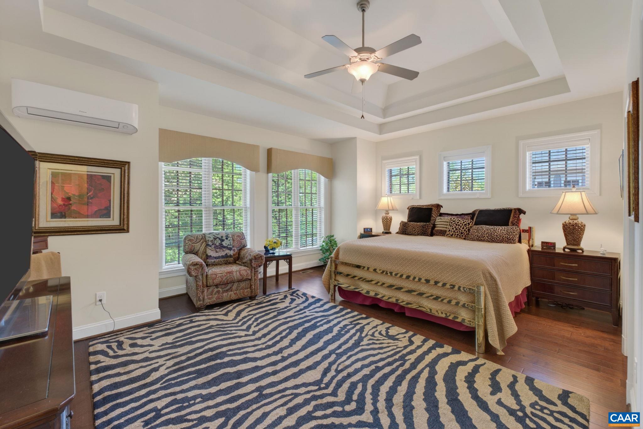 on main level features a double tray ceiling and new wood floors. on main level features a double tray ceiling and new wood floors.