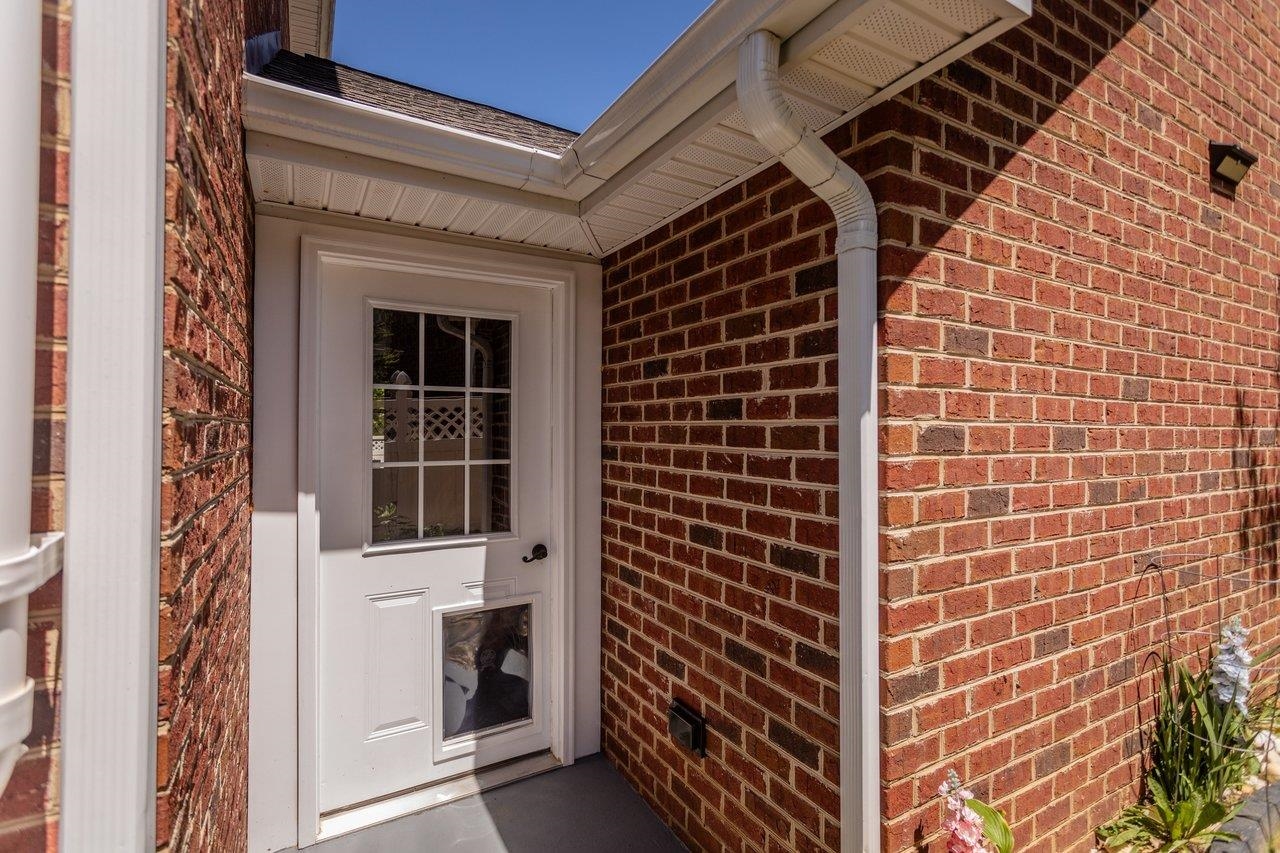 The house and garage are connected by an enclosed breezeway with two entrances. The house and garage are connected by an enclosed breezeway with two entrances.