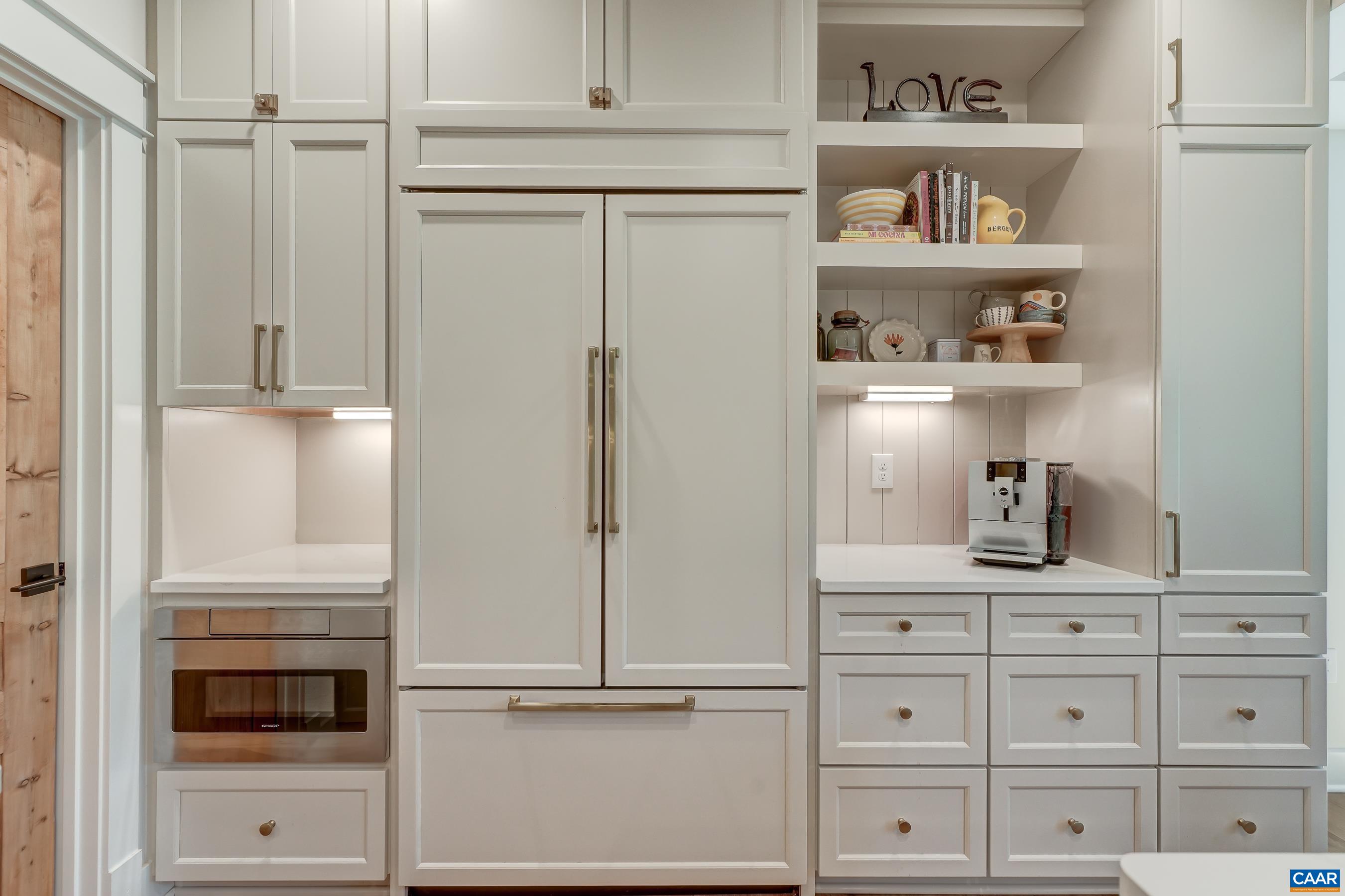 Under cabinet built-in microwave and coffee station. Under cabinet built-in microwave and coffee station.