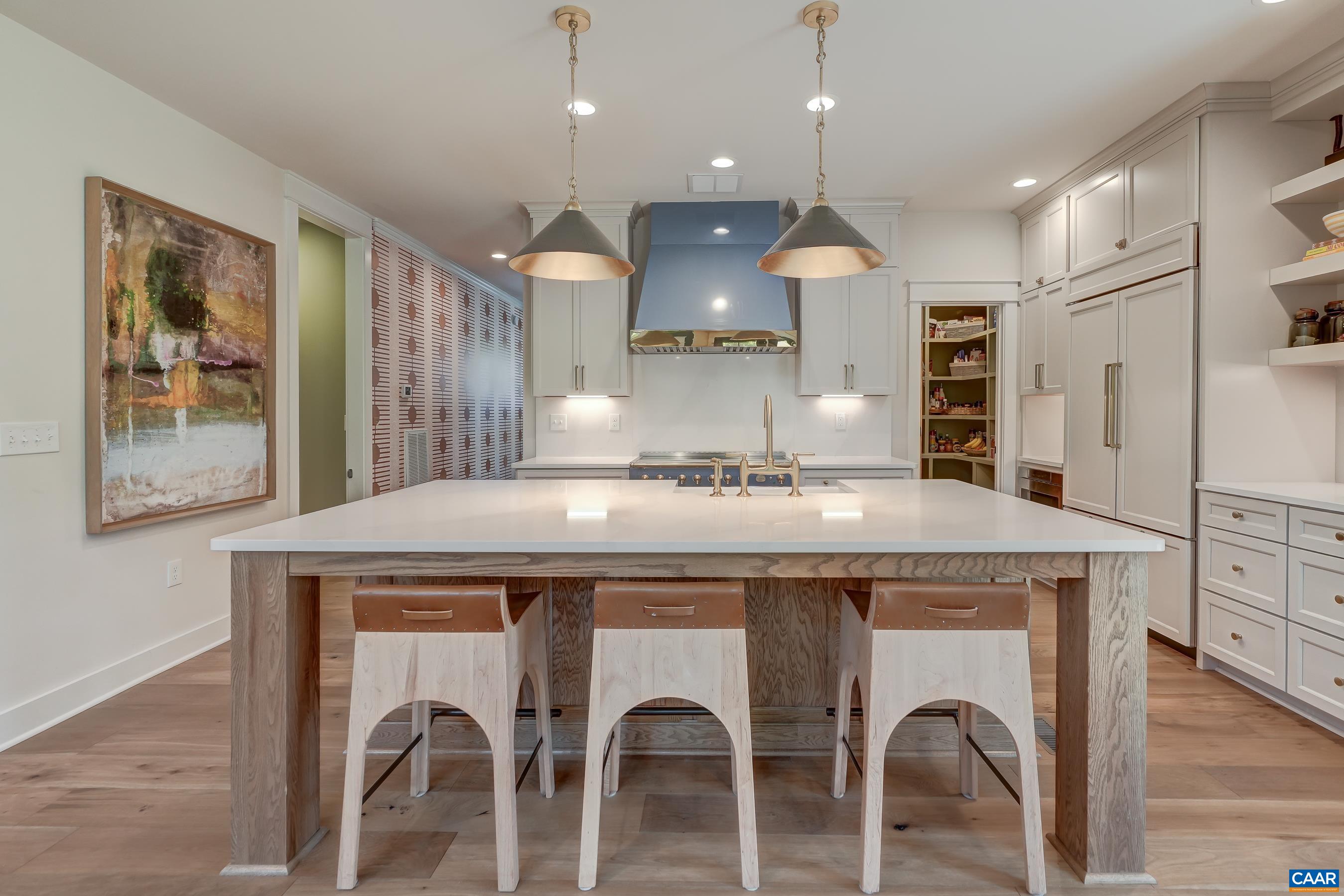 Large quartz island with seating for four. Large quartz island with seating for four.