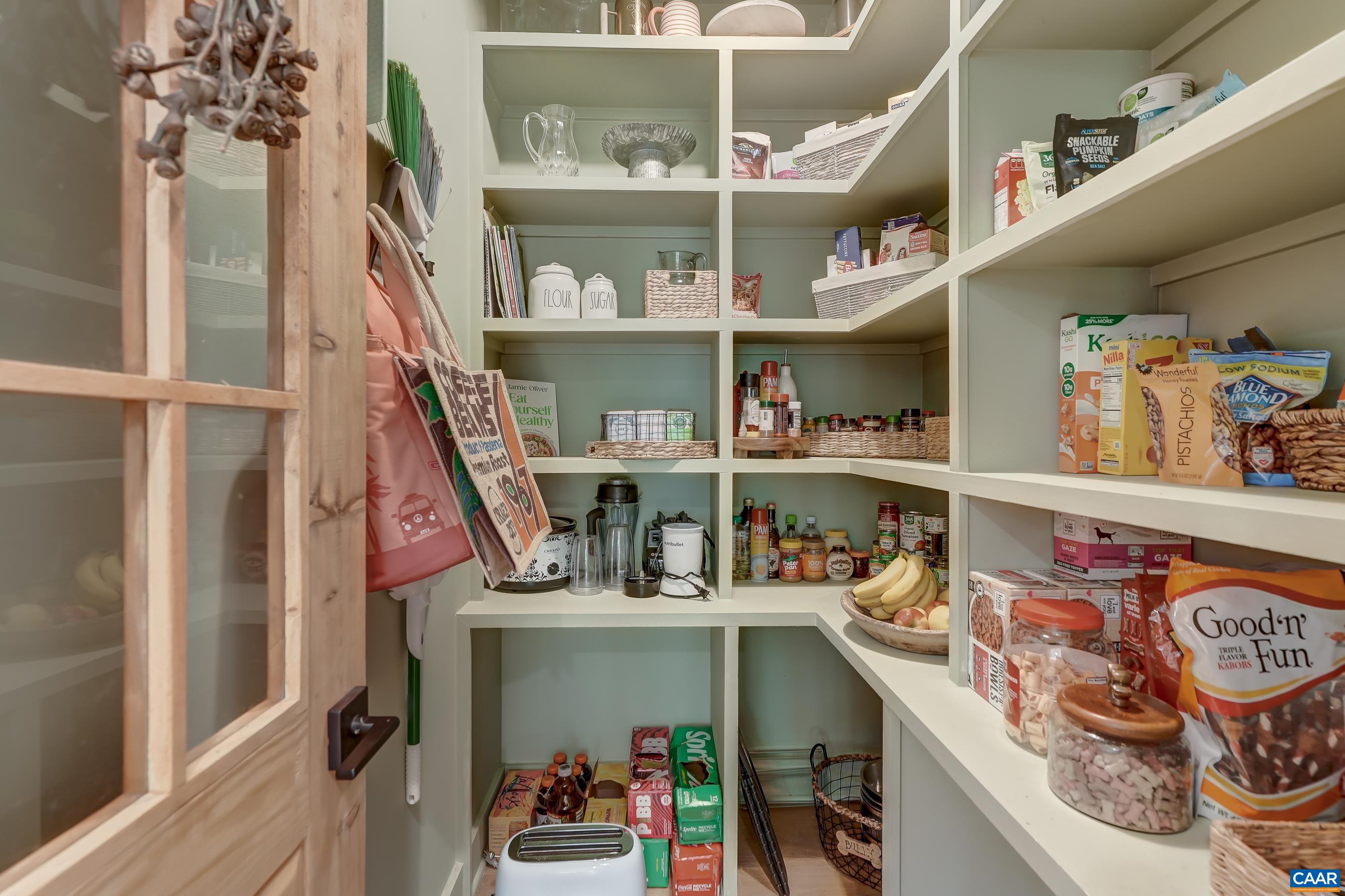 Walk in pantry features solid shelving, and glass door. Walk in pantry features solid shelving, and glass door.
