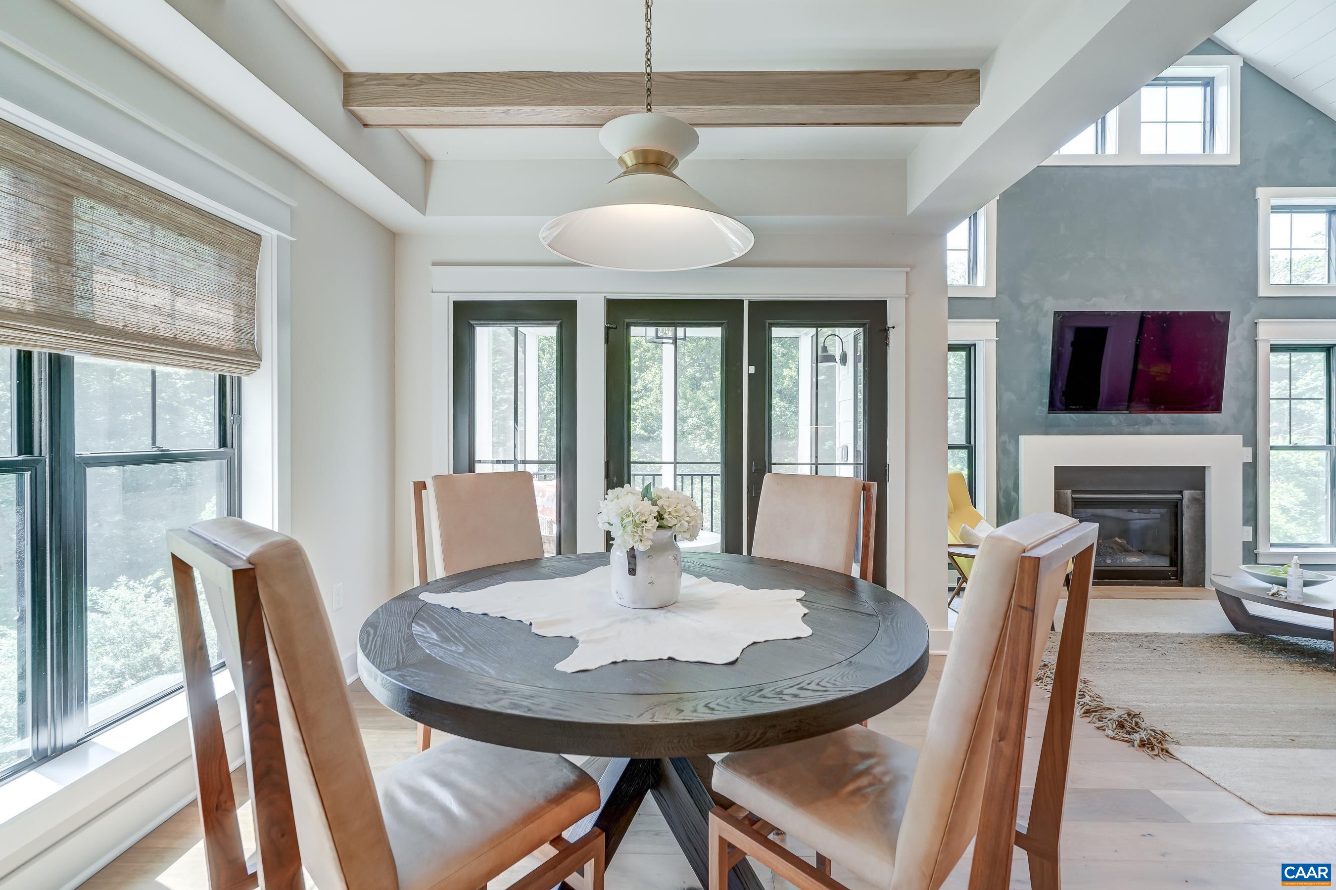 Eat in dining area features natural wood beams, high end lighting and custom window treatments. Eat in dining area features natural wood beams, high end lighting and custom window treatments.