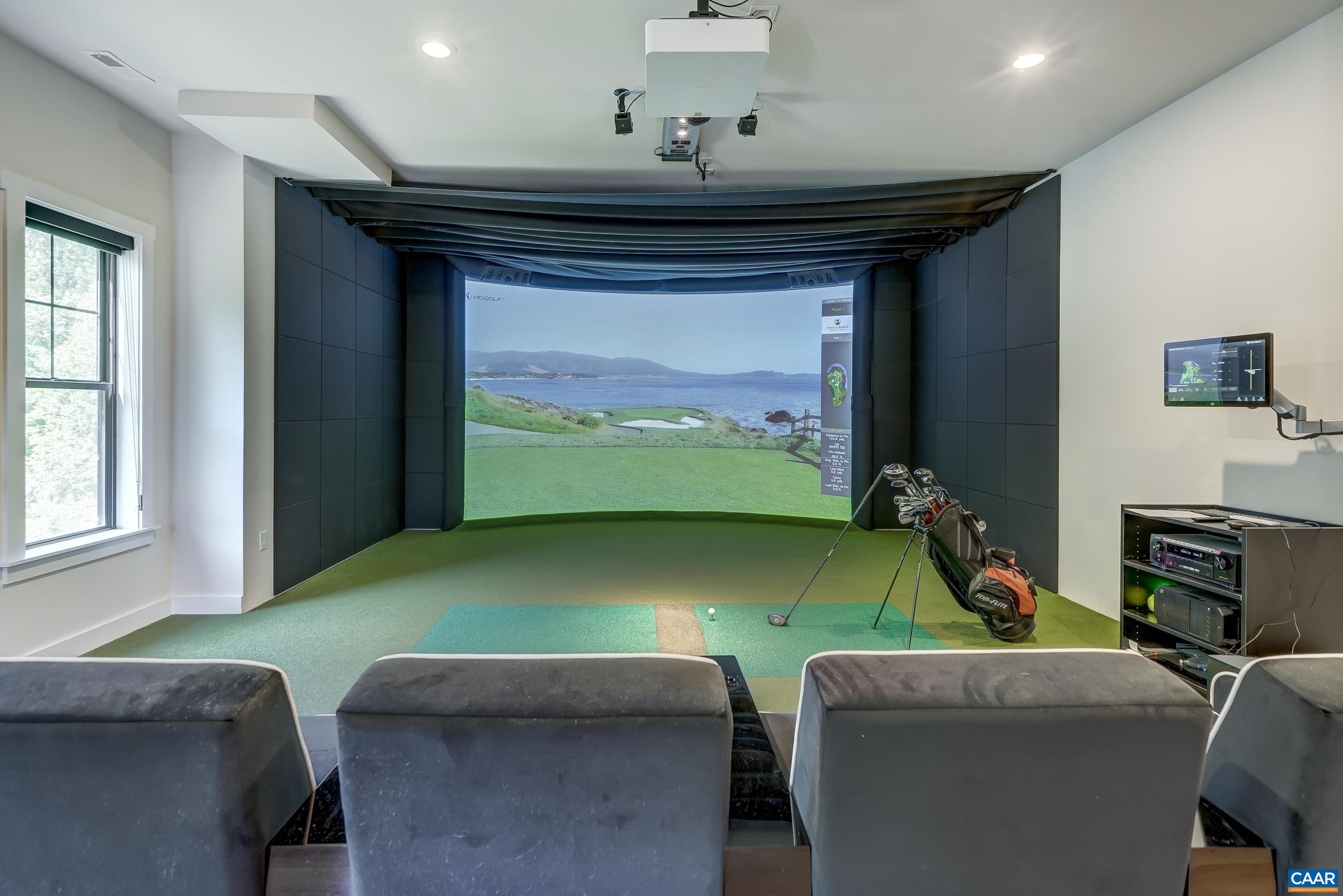 HD Golf multisport simulator and movie theater with custom seating in basement. HD Golf multisport simulator and movie theater with custom seating in basement.