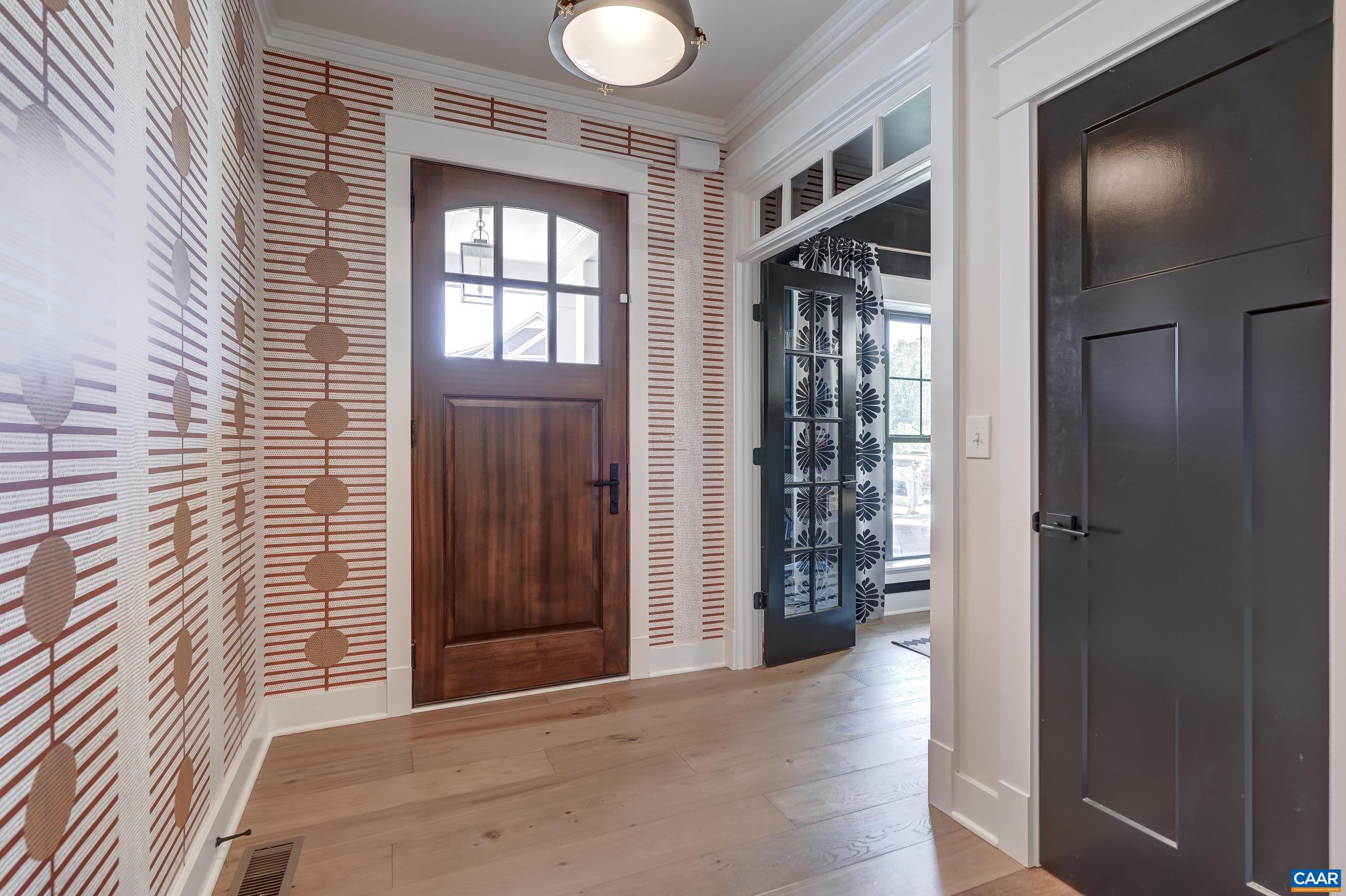 White oak, wide plank floors and custom wall treatments throughout the main level. White oak, wide plank floors and custom wall treatments throughout the main level.