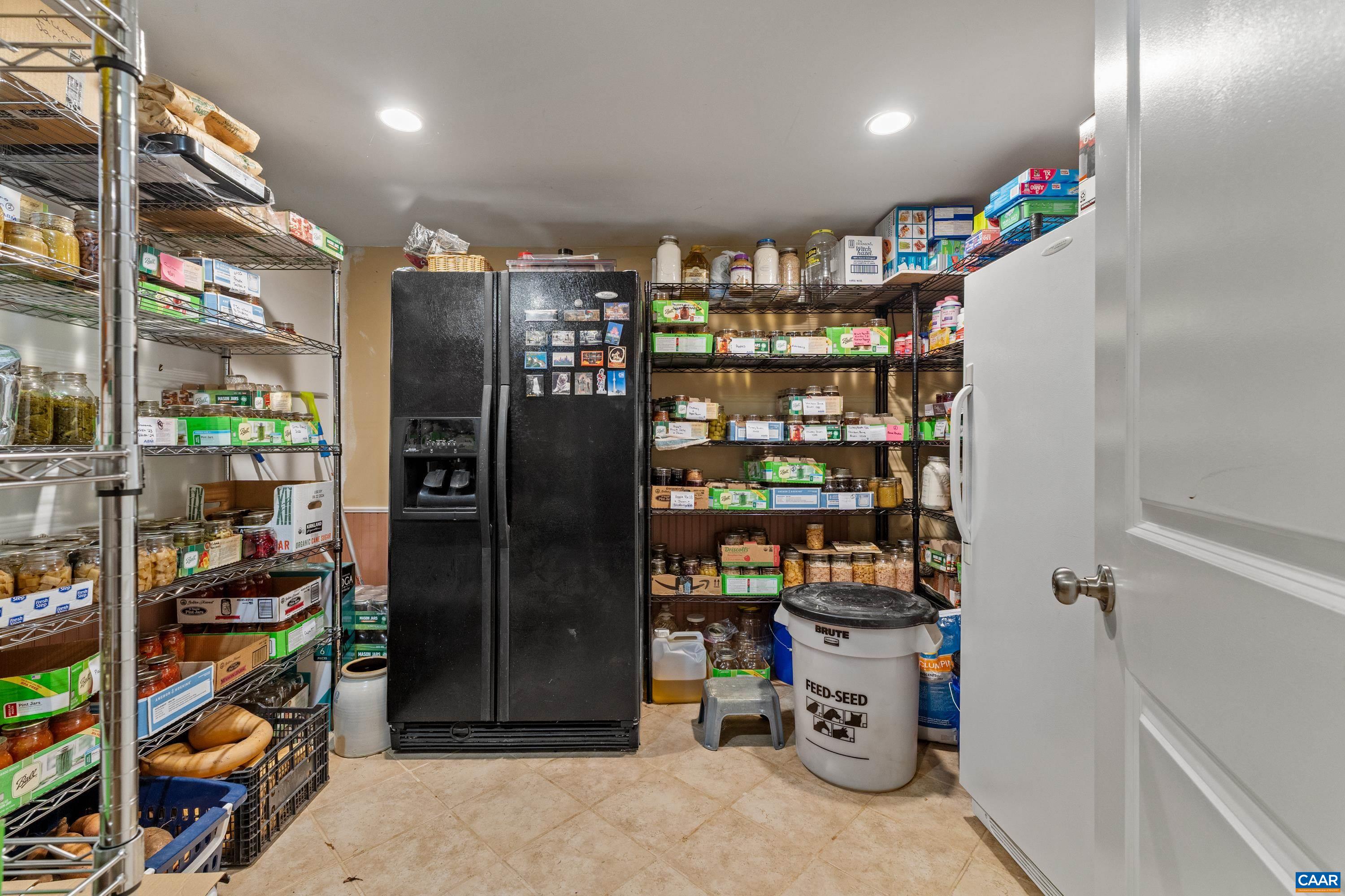 Finished lower-level storage or pantry area with abundant storage capacity. Finished lower-level storage or pantry area with abundant storage capacity.