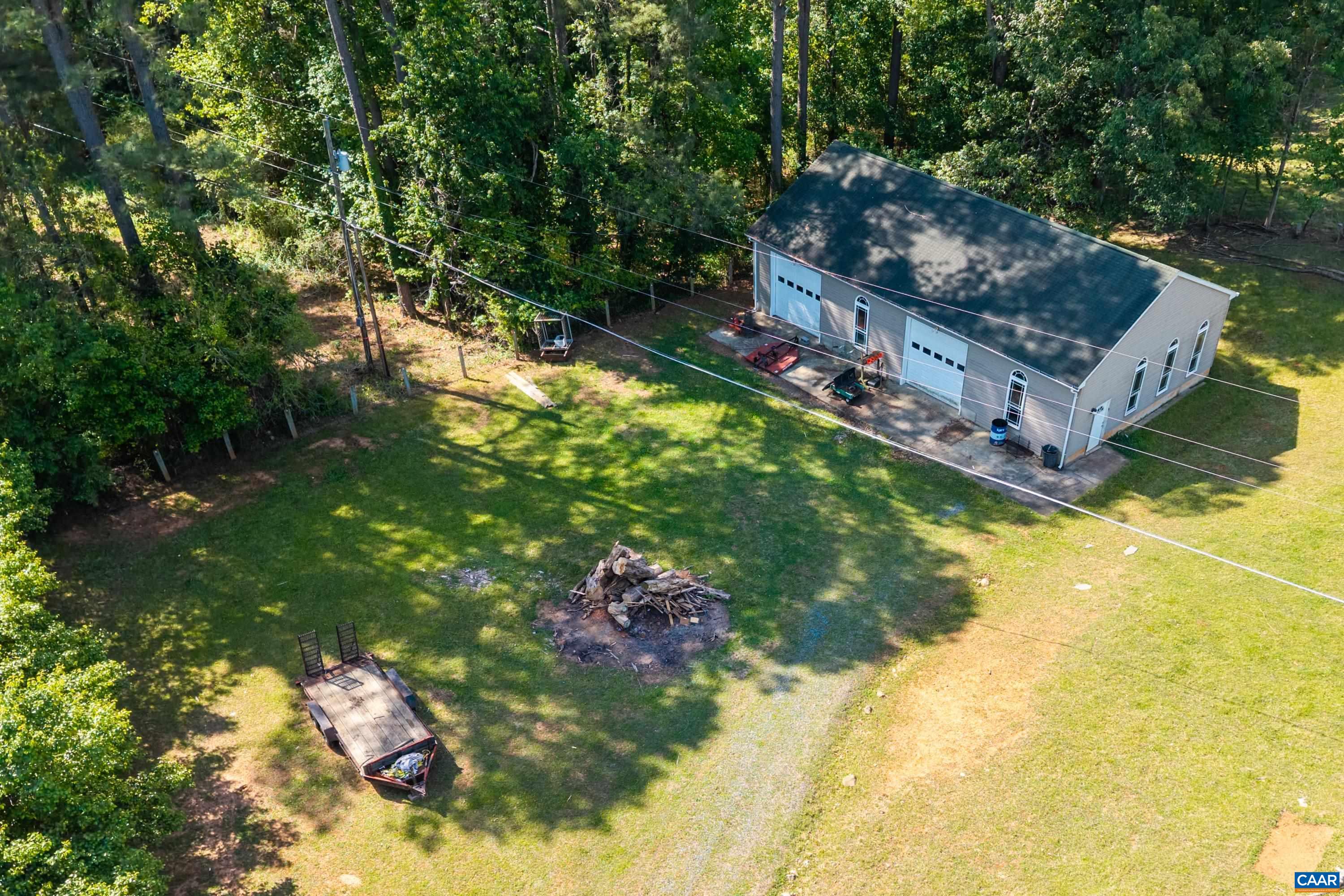 4-bay, 2-door garage/workshop offering substantial space for equipment, storage, projects, or homestead use. 4-bay, 2-door garage/workshop offering substantial space for equipment, storage, projects, or homestead use.