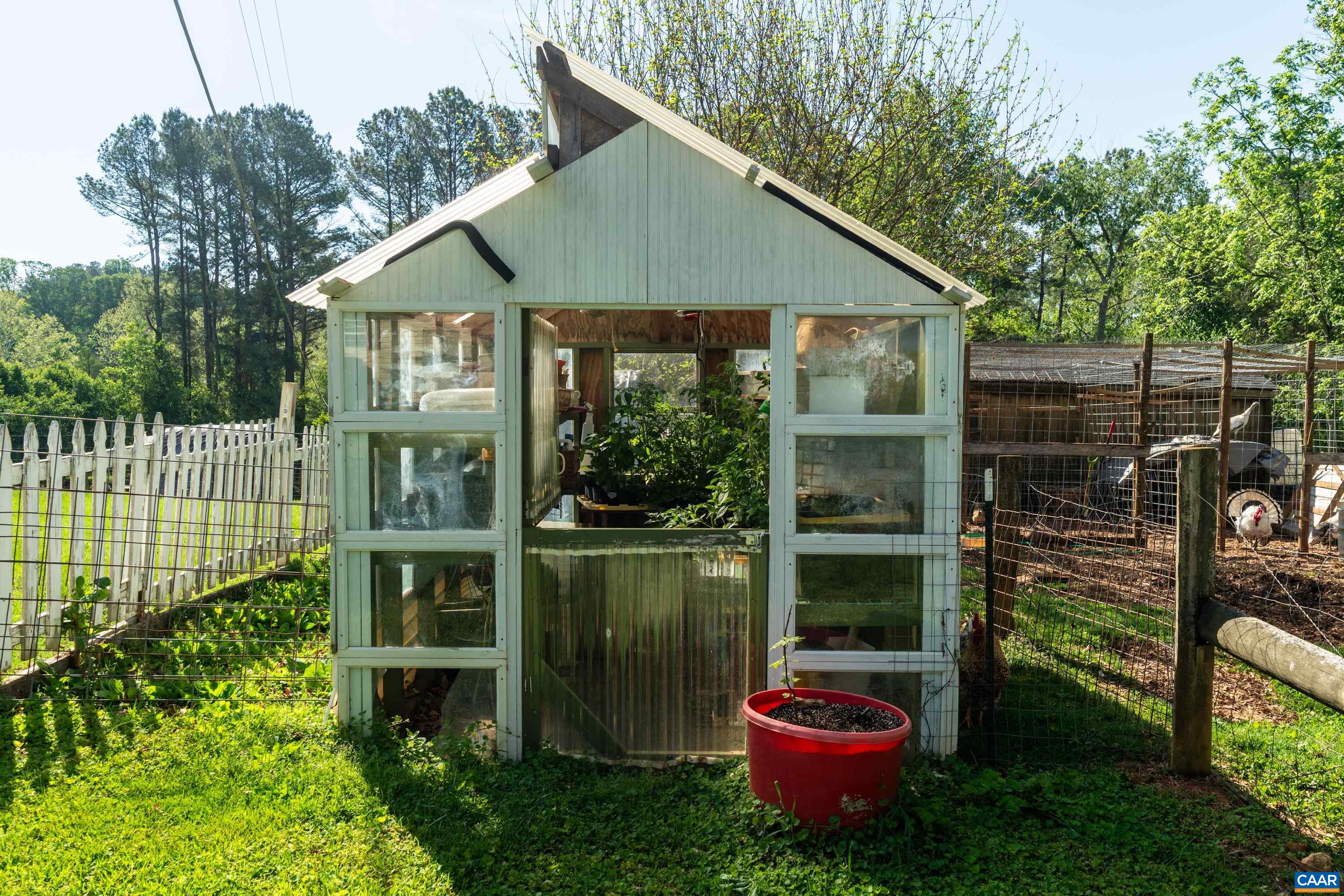 Greenhouse structure supporting seed starting, plant propagation, and extended-season gardening. Greenhouse structure supporting seed starting, plant propagation, and extended-season gardening.