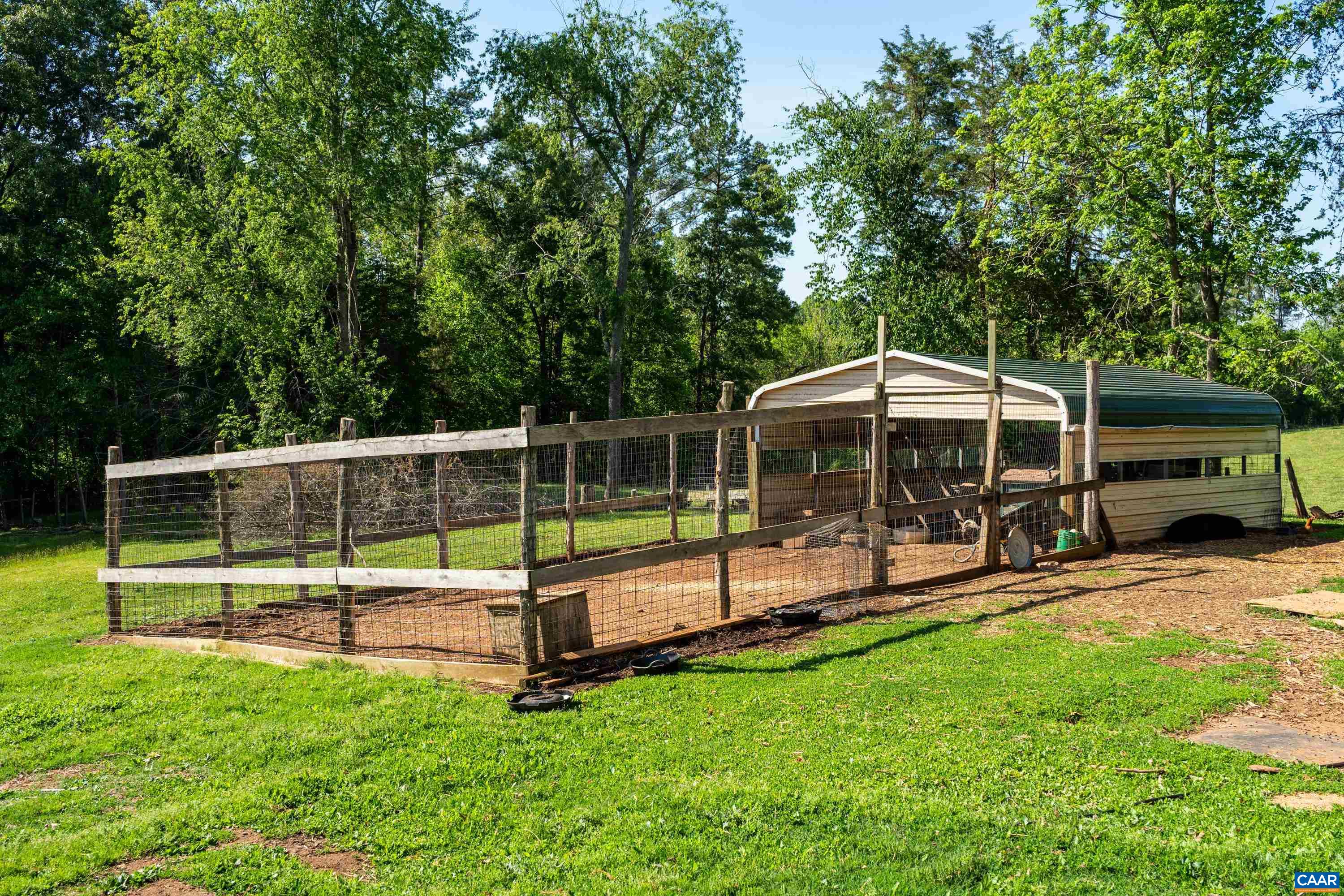 Fenced animal area with shelter, supporting small-scale livestock or homestead use. Fenced animal area with shelter, supporting small-scale livestock or homestead use.