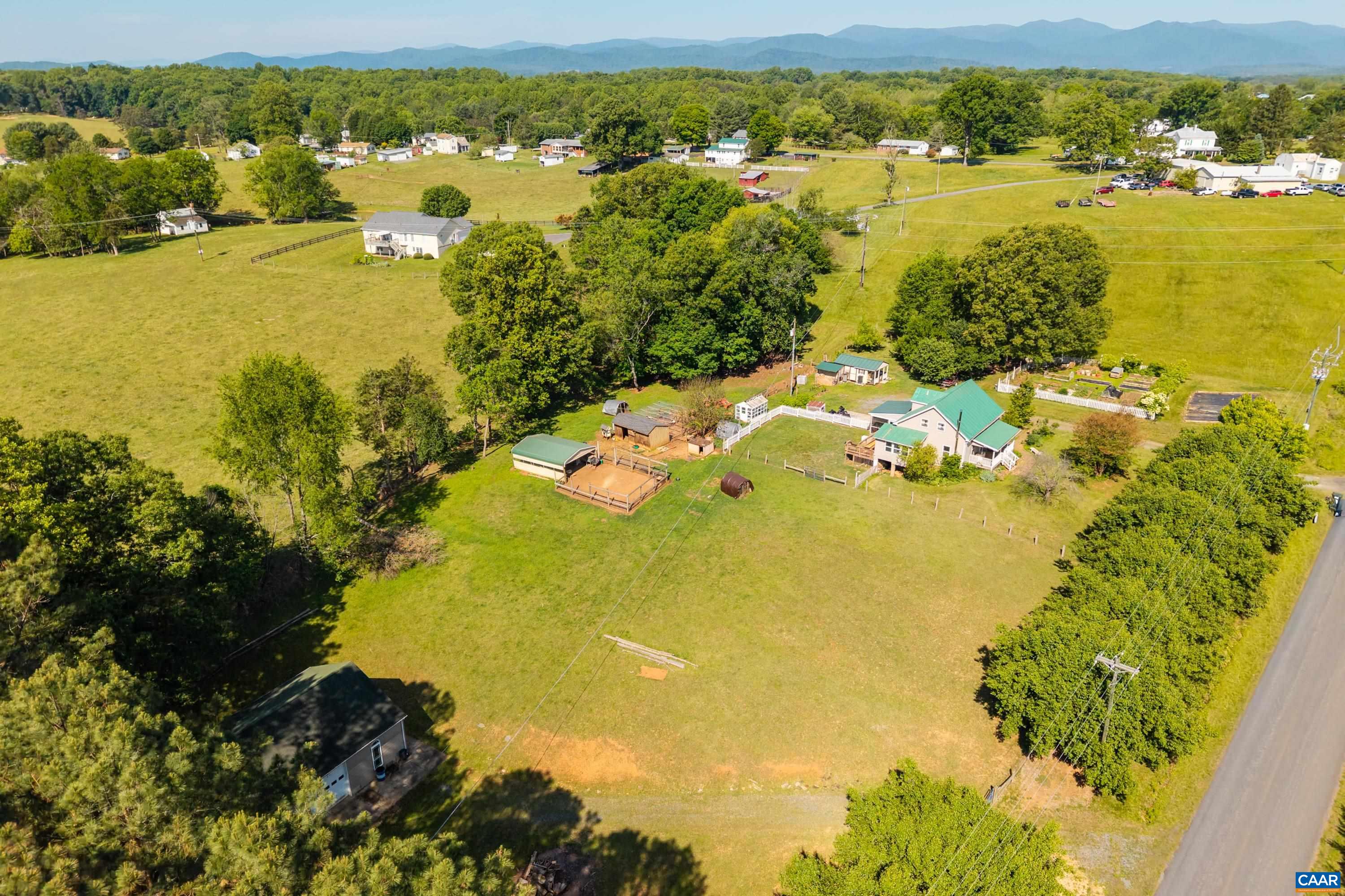 Expansive aerial view of the surrounding countryside and open rural setting. Expansive aerial view of the surrounding countryside and open rural setting.