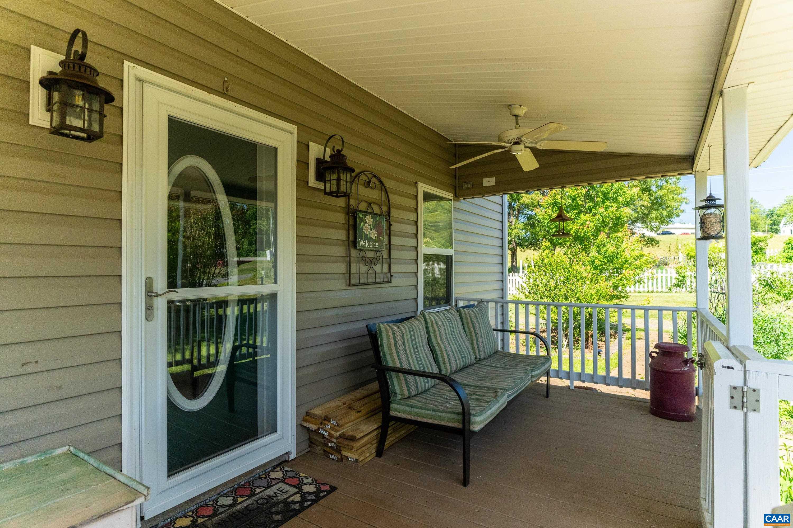 Covered front porch entry offering a welcoming place to relax and enjoy the rural surroundings. Covered front porch entry offering a welcoming place to relax and enjoy the rural surroundings.