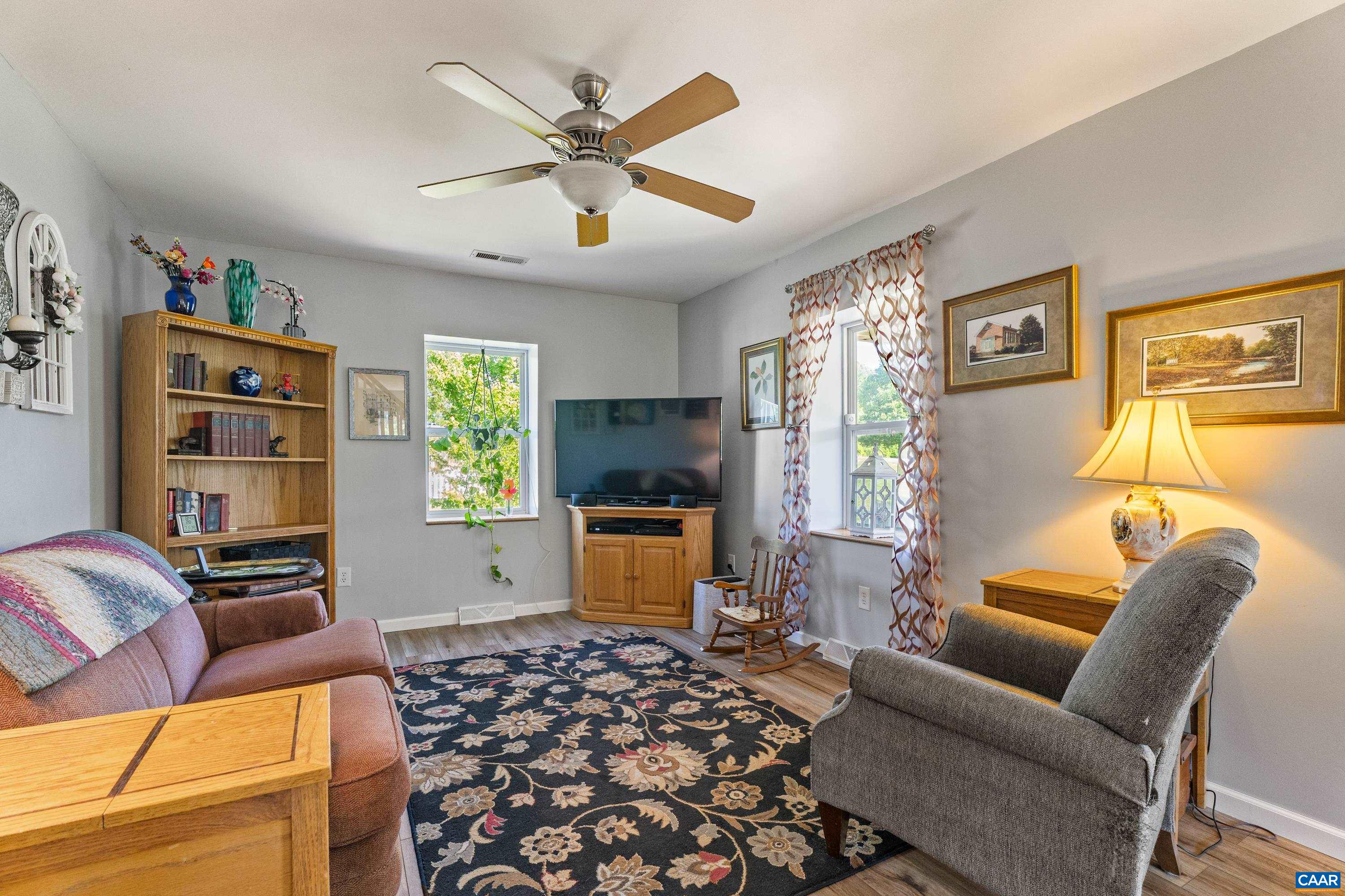 Comfortable living room with a warm, inviting layout. Comfortable living room with a warm, inviting layout.