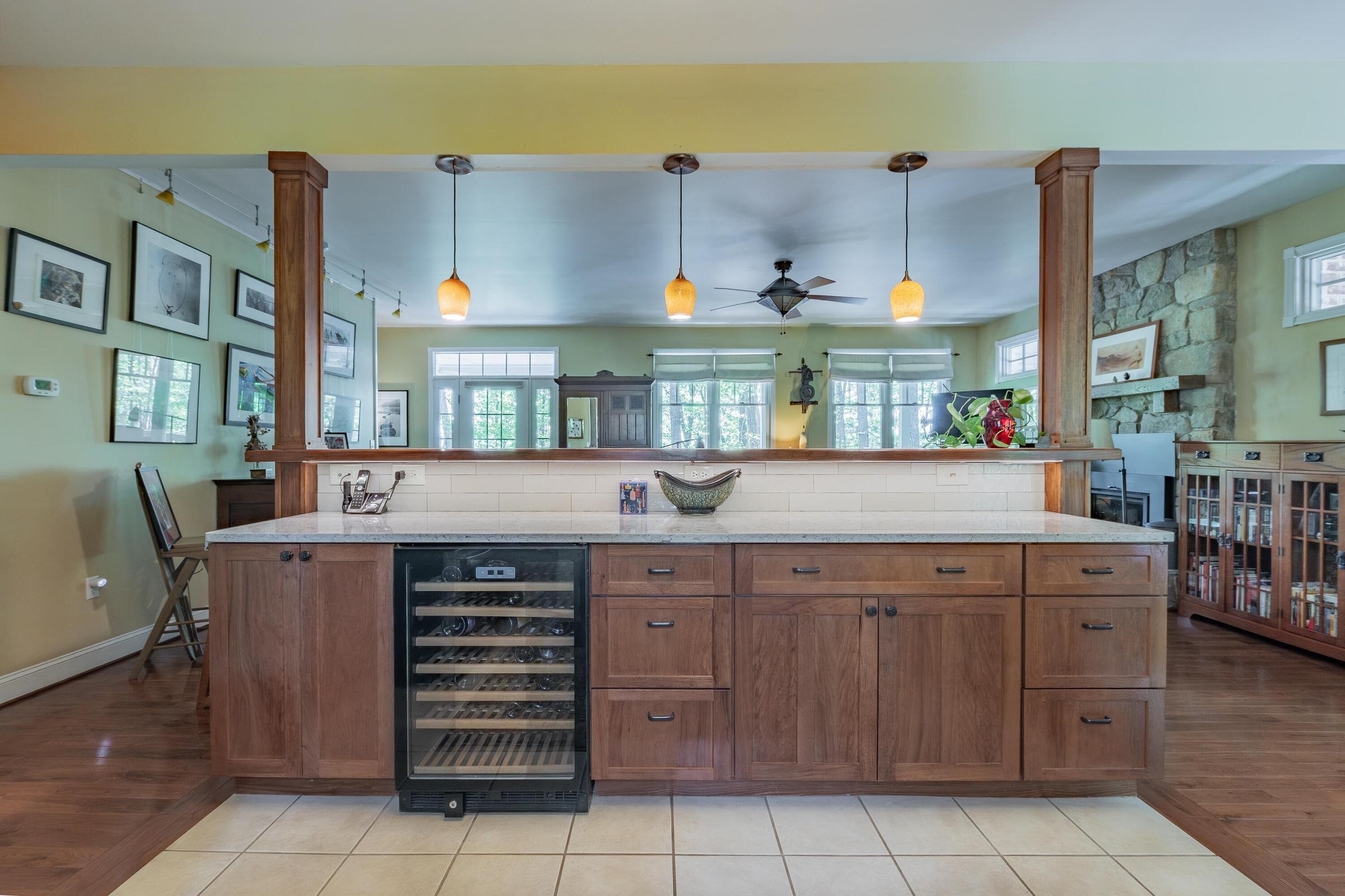 Tile floors in the kitchen. Wood cabinets add warmth to the kitchen. Tile floors in the kitchen. Wood cabinets add warmth to the kitchen.
