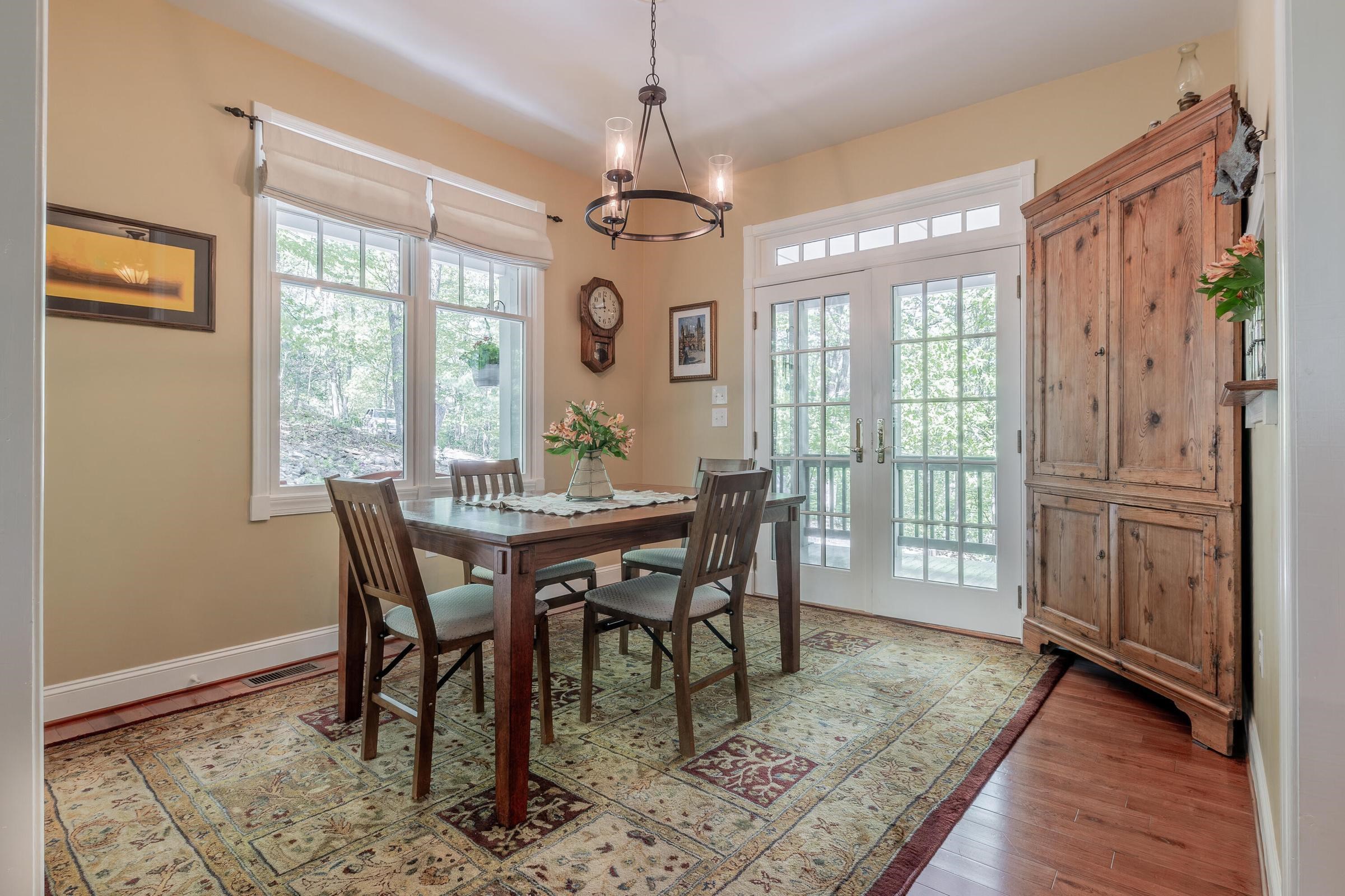 Open floor plan includes the dining room. Door leads to the wrap around porch. Windows invite the serenity of the forest. Good for digestion. Open floor plan includes the dining room. Door leads to the wrap around porch. Windows invite the serenity of the forest. Good for digestion.