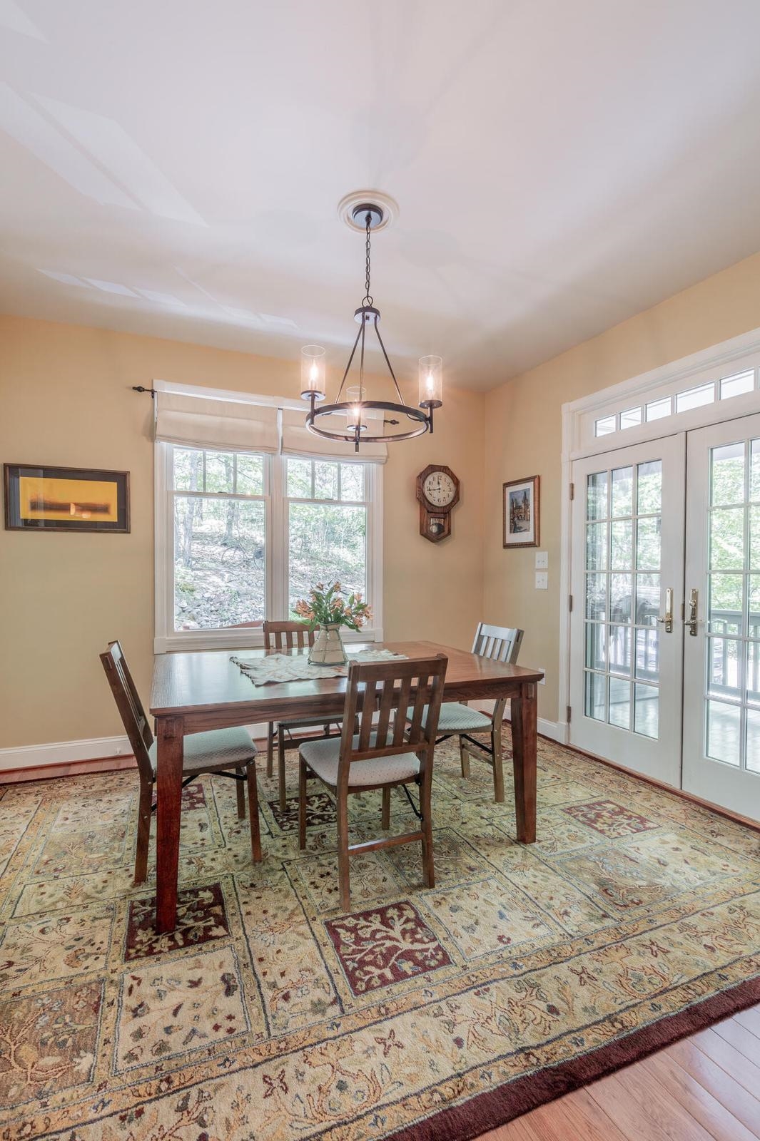 Double doors enter into the dining room from the porch. Double doors enter into the dining room from the porch.