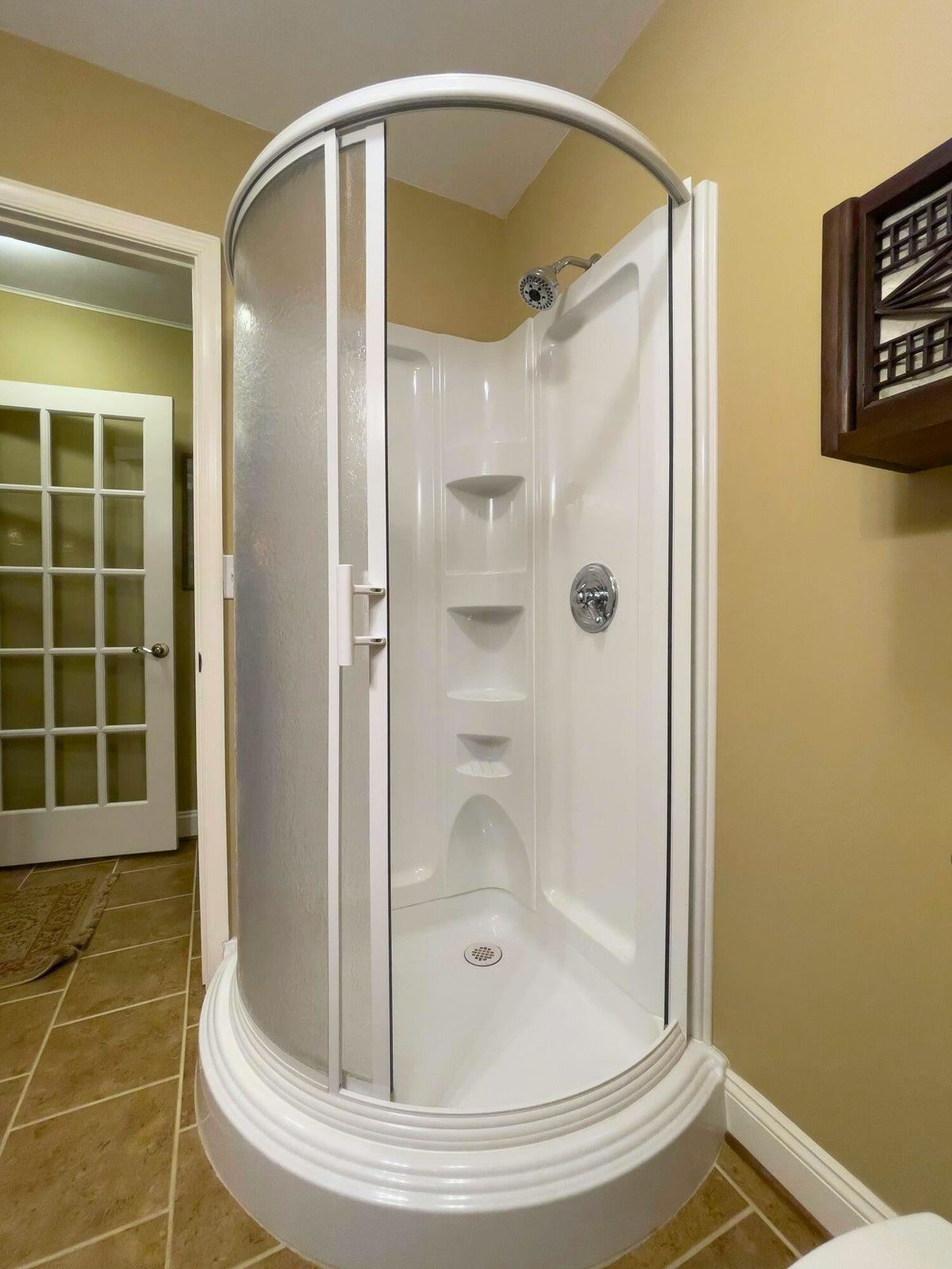 Shower in the lower level bath. Shower in the lower level bath.