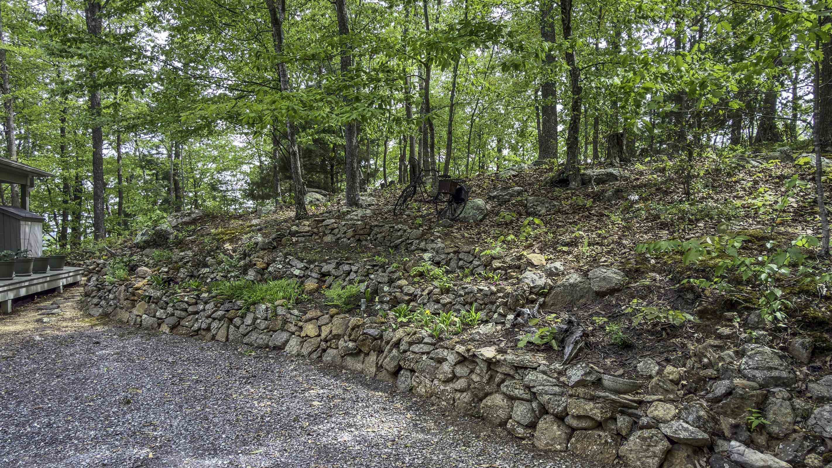 Hand laid stone wall makes a terraced flower garden. Hand laid stone wall makes a terraced flower garden.