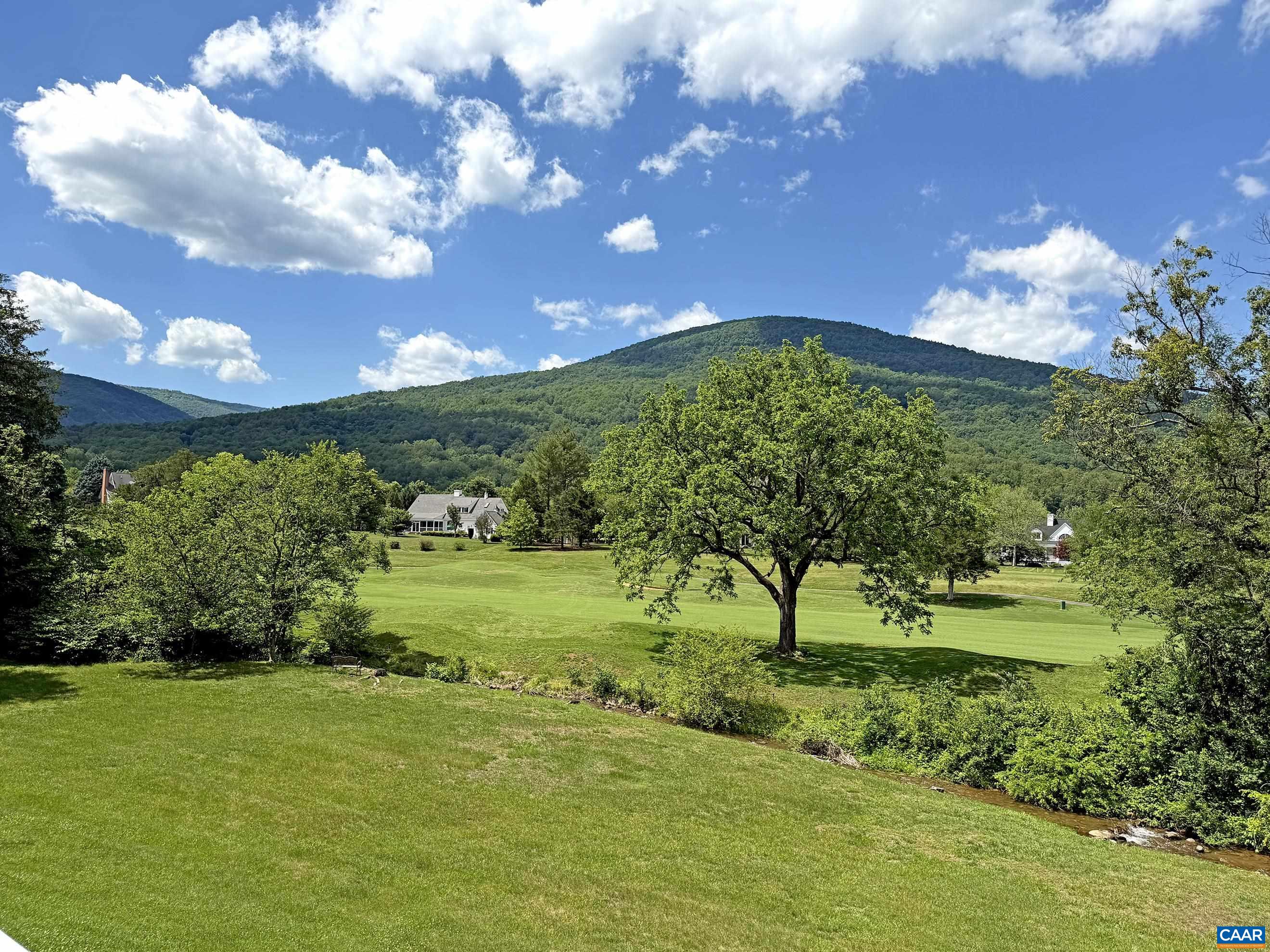 This beautiful property offers breathtaking mountain, golf fairway, stream, sunset and sunrise views.